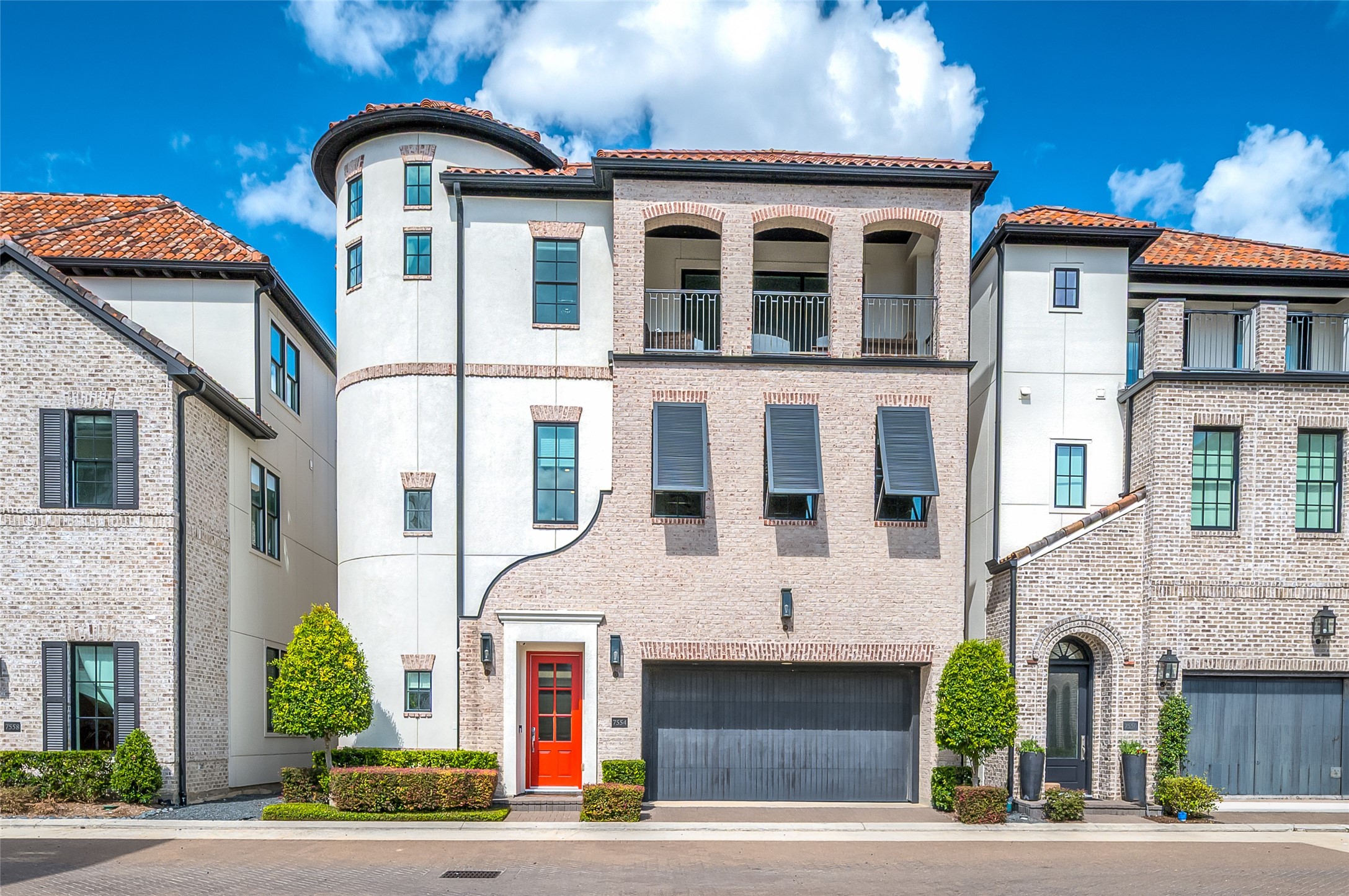 Welcome to 7554 Little Caprese, an exquisite Traditional/ Mediterranean -inspired residence in Ravenna, showcasing refined architectural details, a distinctive turret, elegant arched balconies, and a sophisticated blend of brick and stucco, complemented by a classic red tile roof. Welcome to 7554 Little Caprese, an exquisite Traditional/ Mediterranean -inspired residence in Ravenna, showcasing refined architectural details, a distinctive turret, elegant arched balconies, and a sophisticated blend of brick and stucco, complemented by a classic red tile roof.