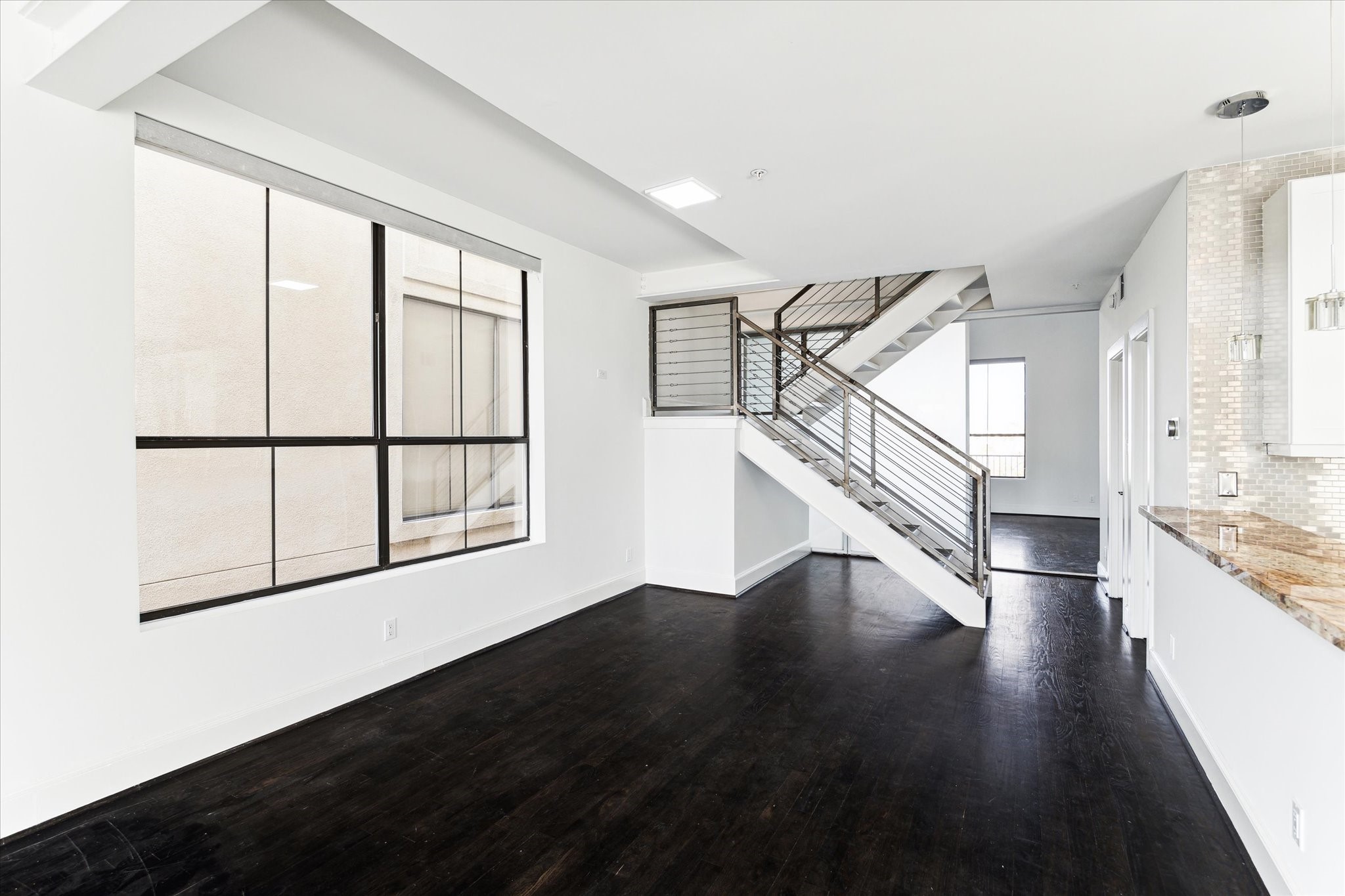 Inviting dining area that flows seamlessly into the living room and kitchen, creating an open, connected space perfect for entertaining and everyday family gatherings.