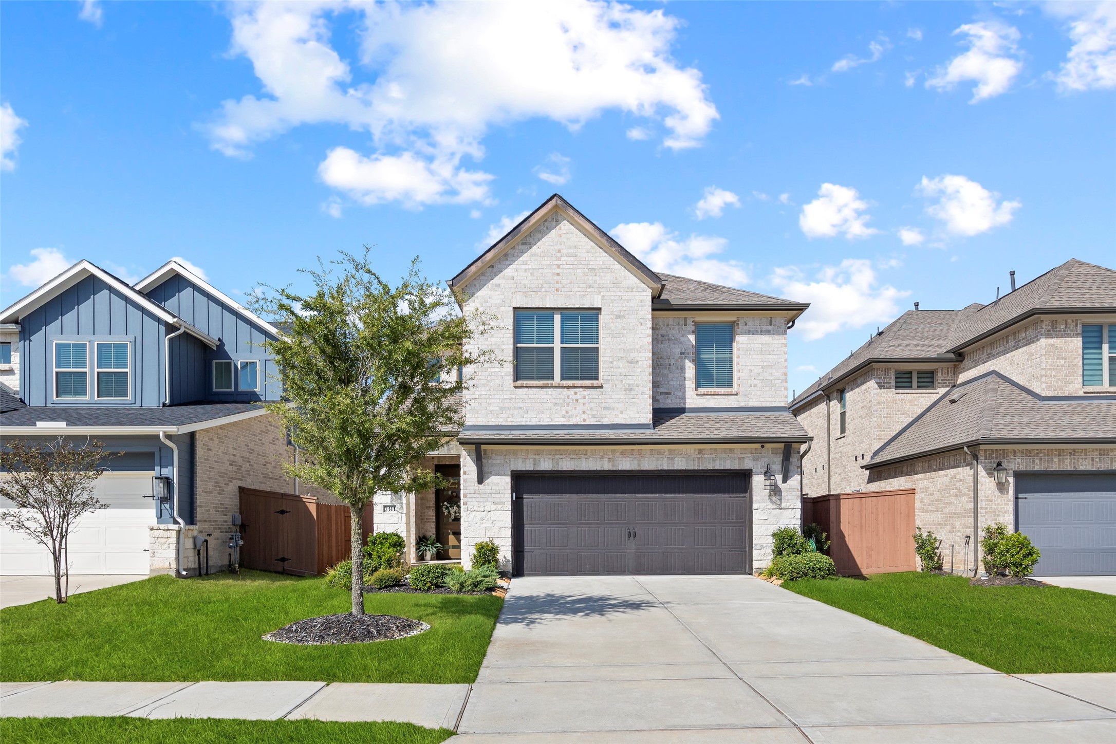 Welcome to 7311 Winding Aster Way in the master-planned community of Elyson. Built by Westin Homes in 2024, this two-story residence offers four bedrooms, three full baths and one half bath across approximately 2,425 square feet. Light brick, contrasting trim and a two-car garage create an inviting first impression.