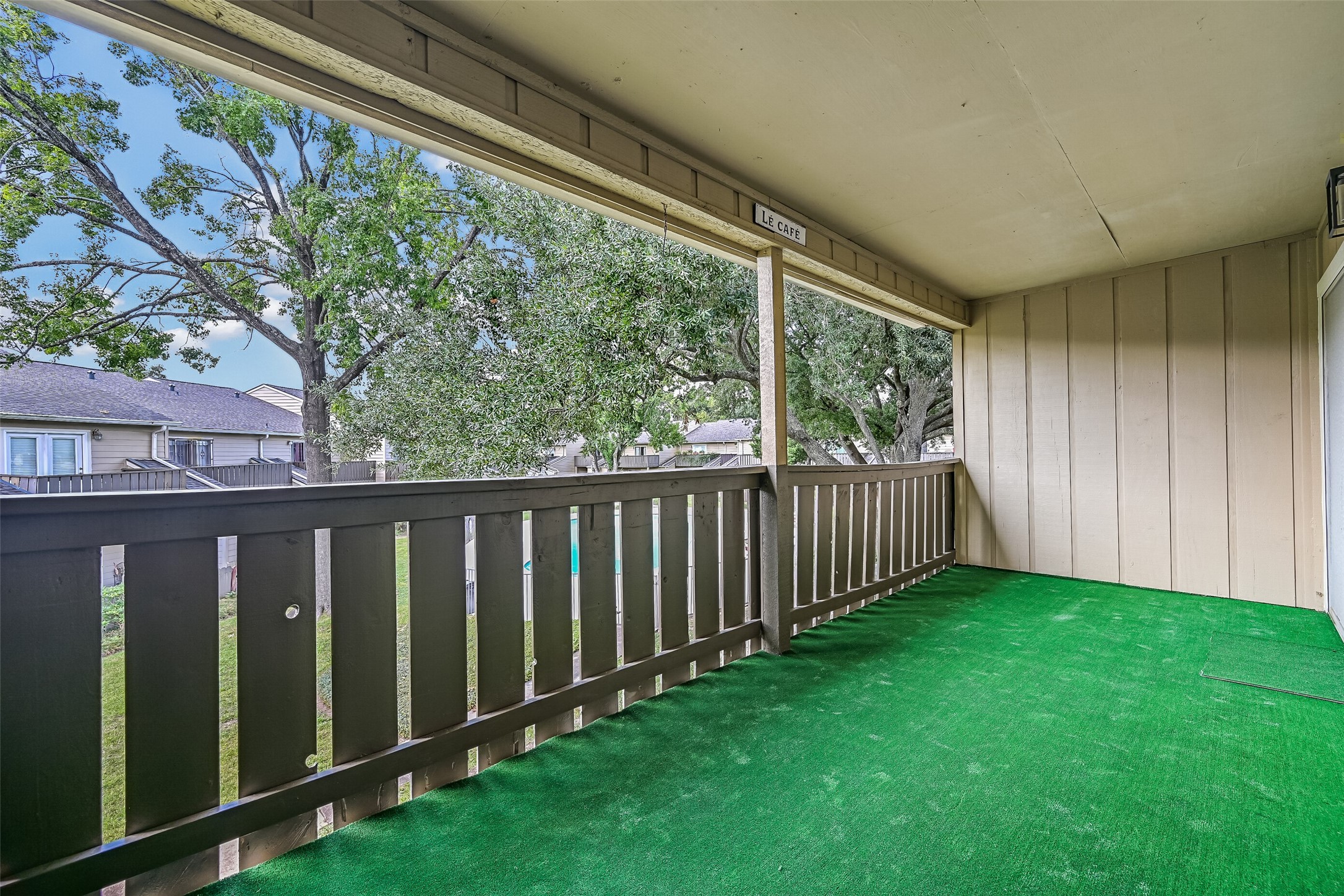 Enjoy views of the mature shade trees, landscaped courtyard & glimpses of the community pool from this spacious second-floor balcony! With plenty of room for patio furniture, this covered outdoor space provides a wonderful extension of the condo's living area & a great spot to unwind.