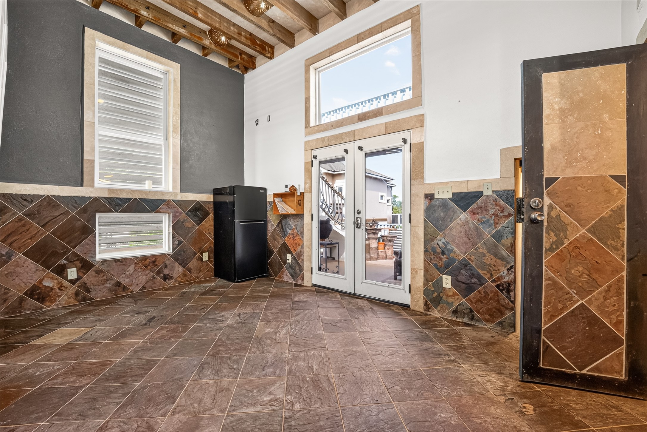 Double glass doors lead to patio.