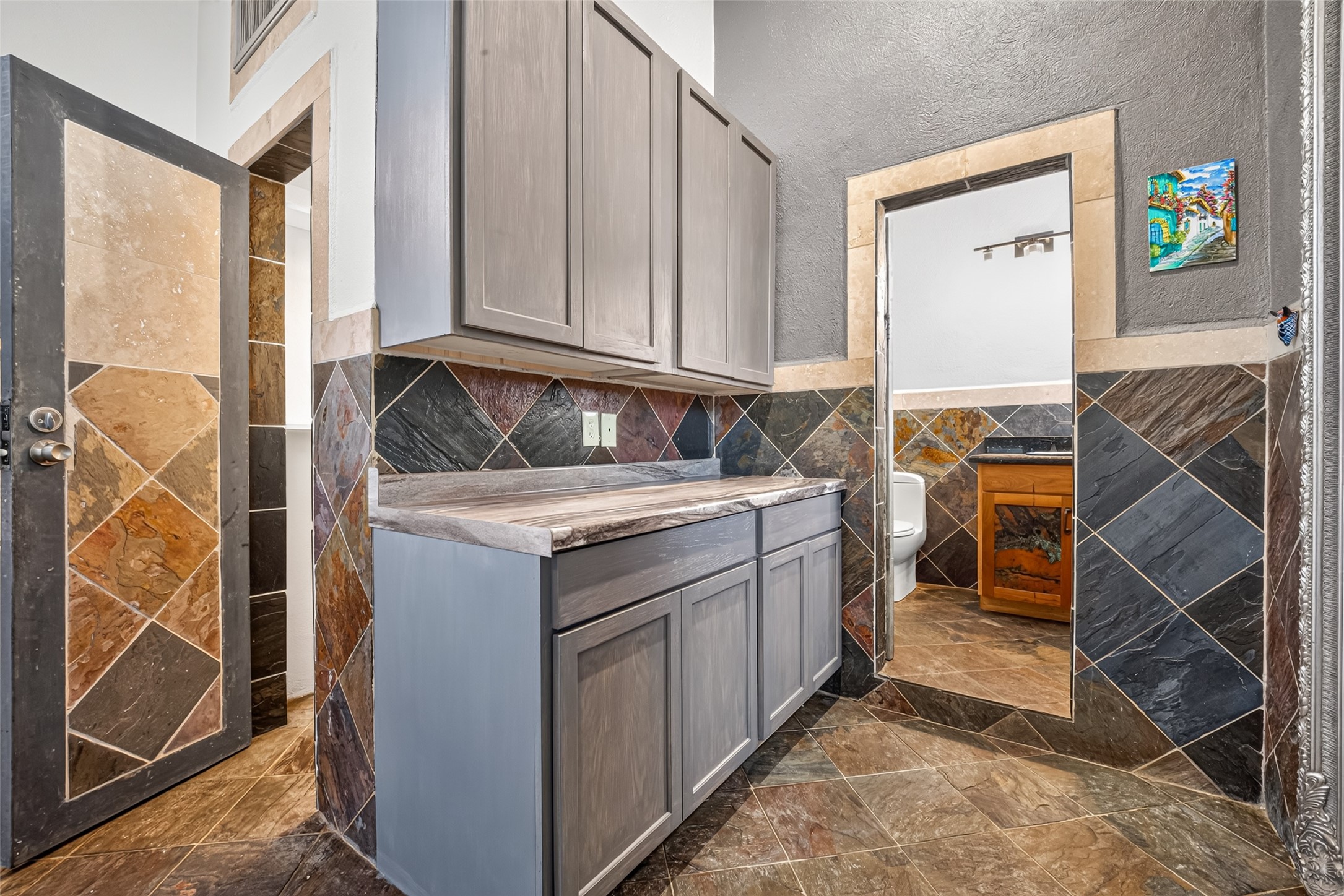 Large custom cabinetry. Ideal space for a microwave / toaster oven, coffee pot. all you need if you are that BUSY BUSY on the GO person.
