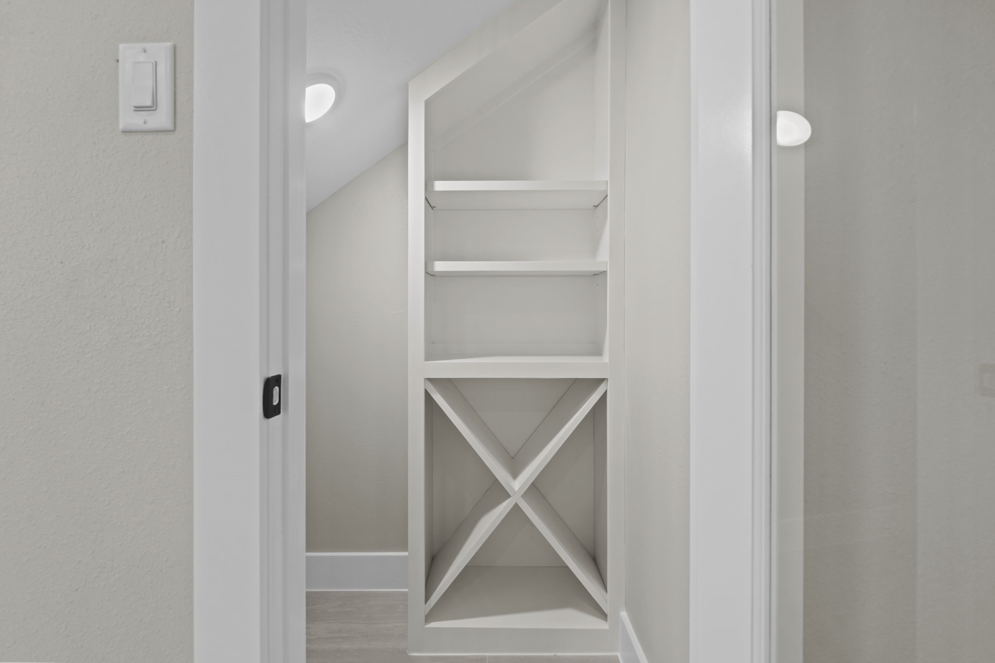 Smart space management is highlighted in this specialized storage niche designed directly into the homes layout.