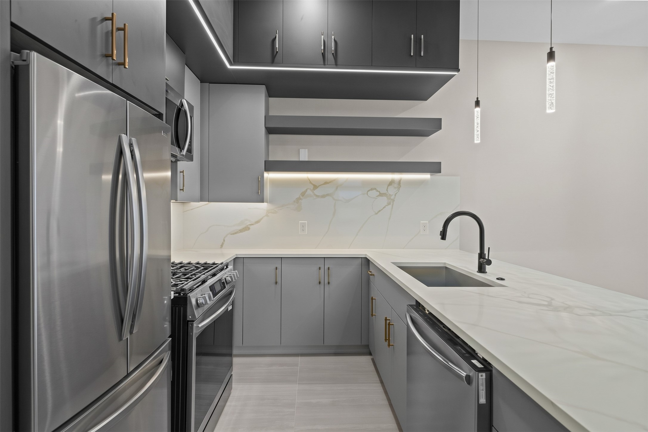 Virtually Staged: Sleek hardware, integrated appliances, and clean countertop surface area complete this refined, space-efficient design.