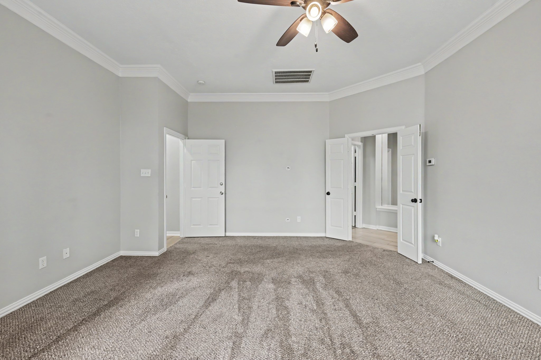 Another view of the primary bedroom