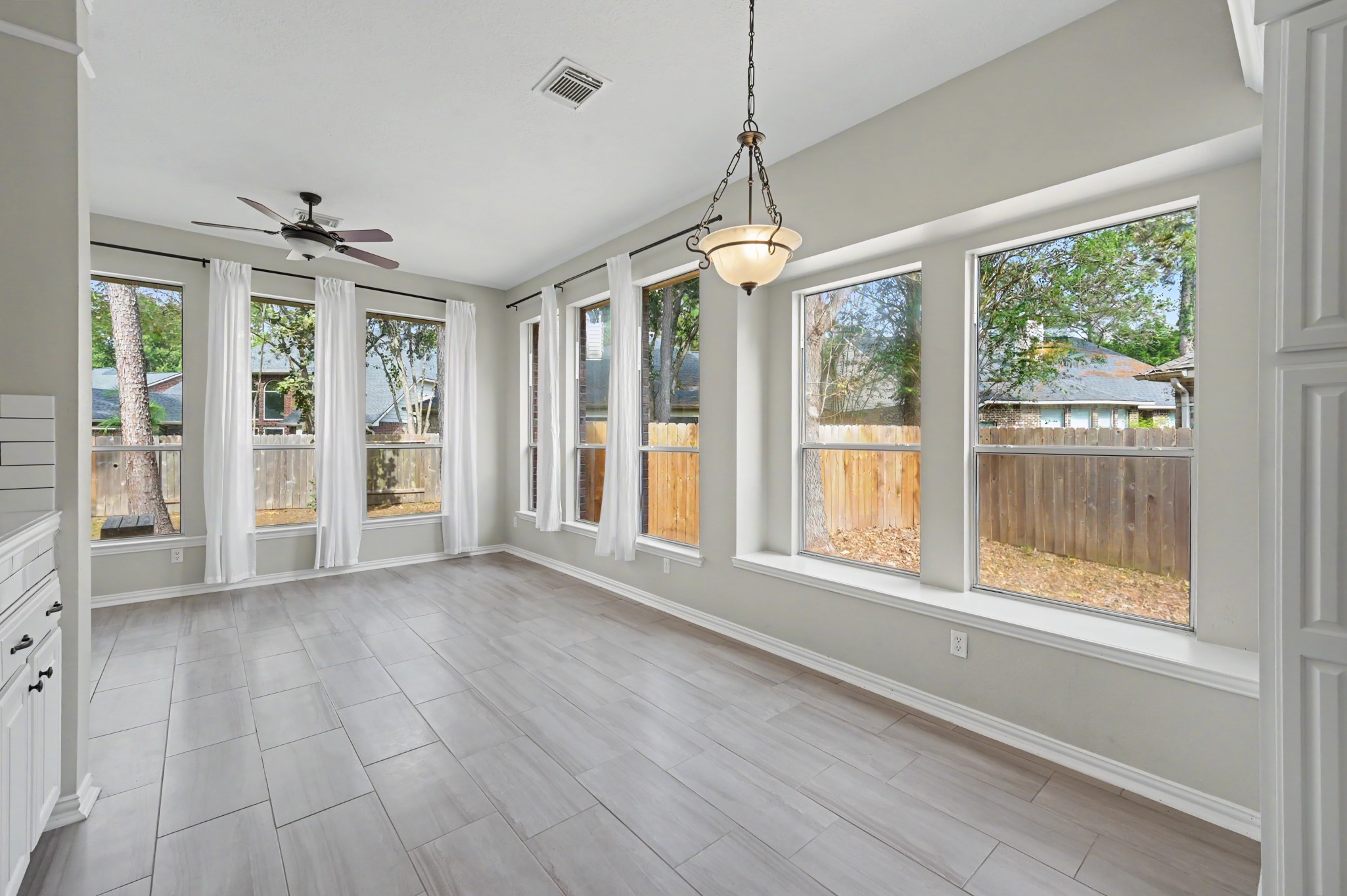 Another view of the breakfast room with the stunning walls of windows!