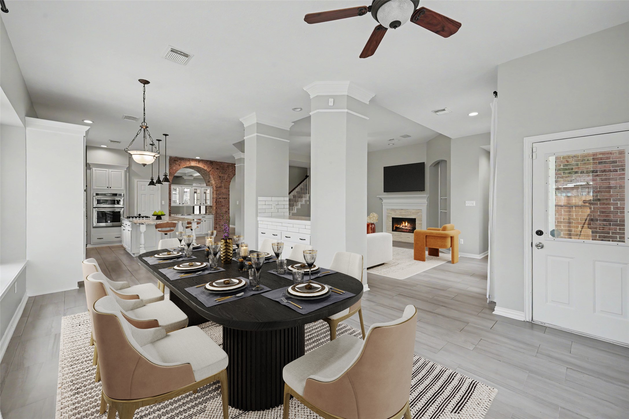 Breakfast area with tons of windows and natural light that fills the room! Beautiful Built ins between the living and  breakfast room perfect for serving and storage! Furniture virtually staged.