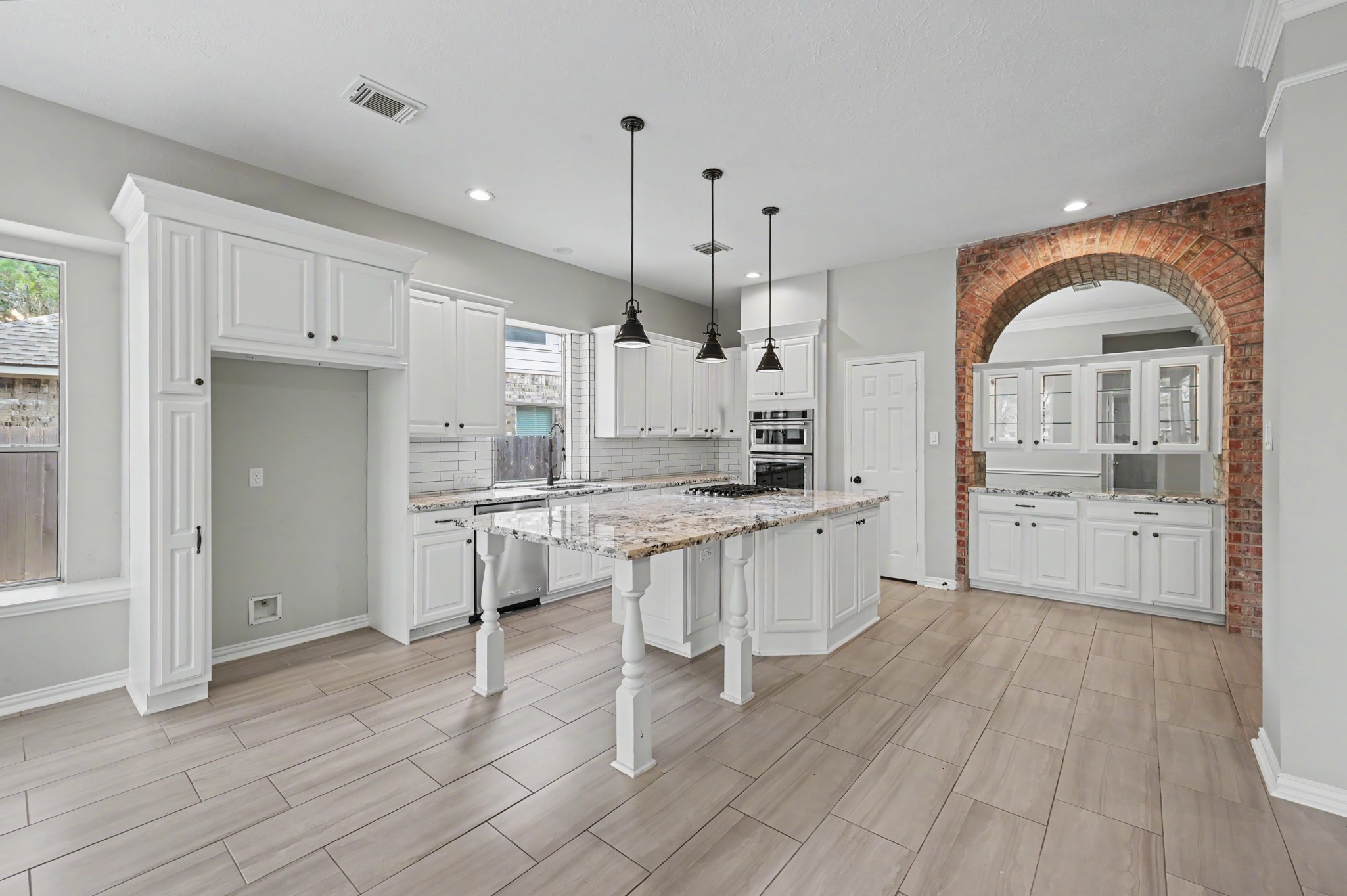 Fully updated Kitchen offers 42 inch cabinets, tons of seating at your oversized island and is open to the breakfast room and living area!