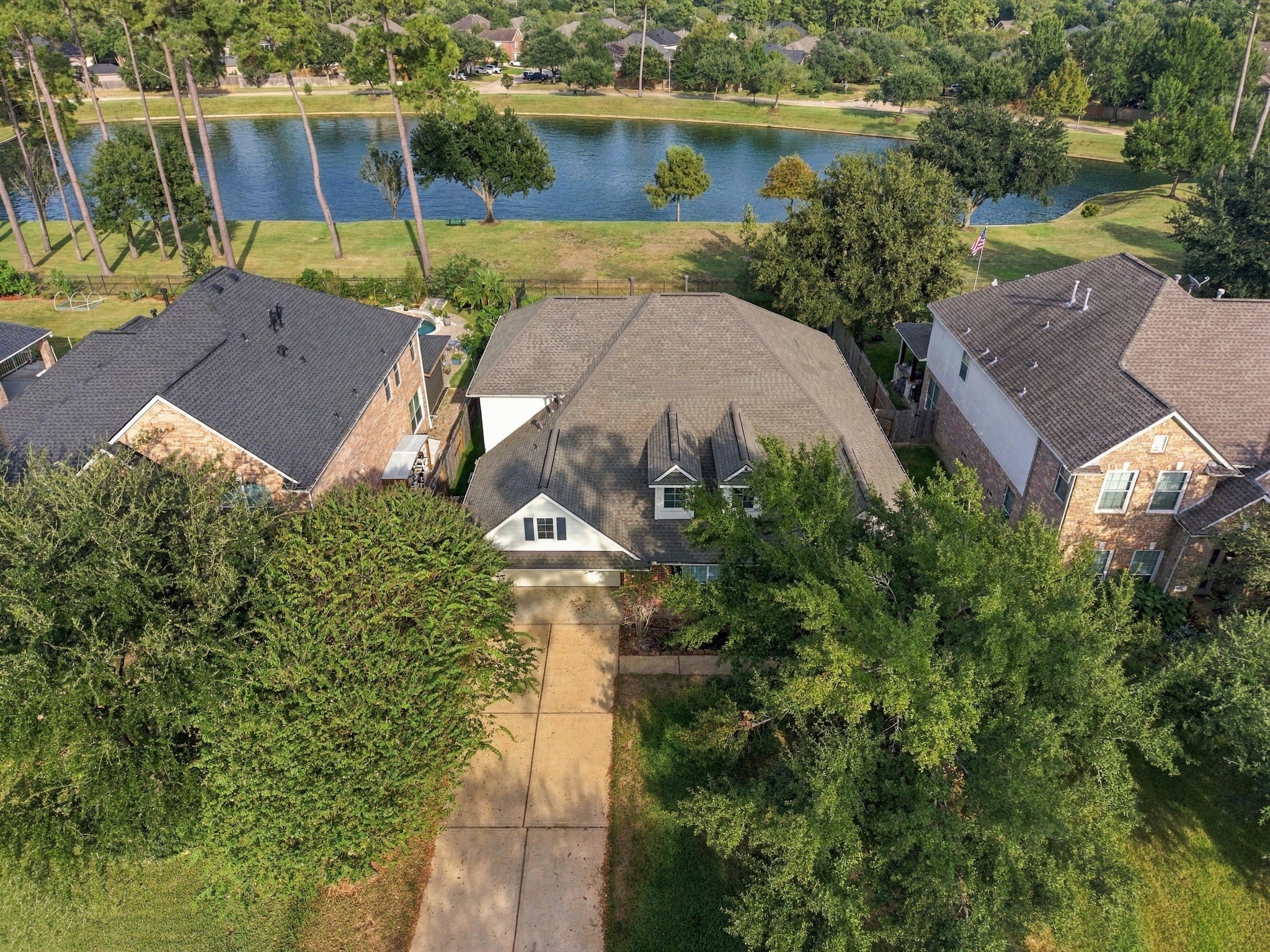 Highlighting exceptional neighborhood positioning, this bird's-eye perspective reveals an expansive lot nestled along a scenic waterfront backdrop.