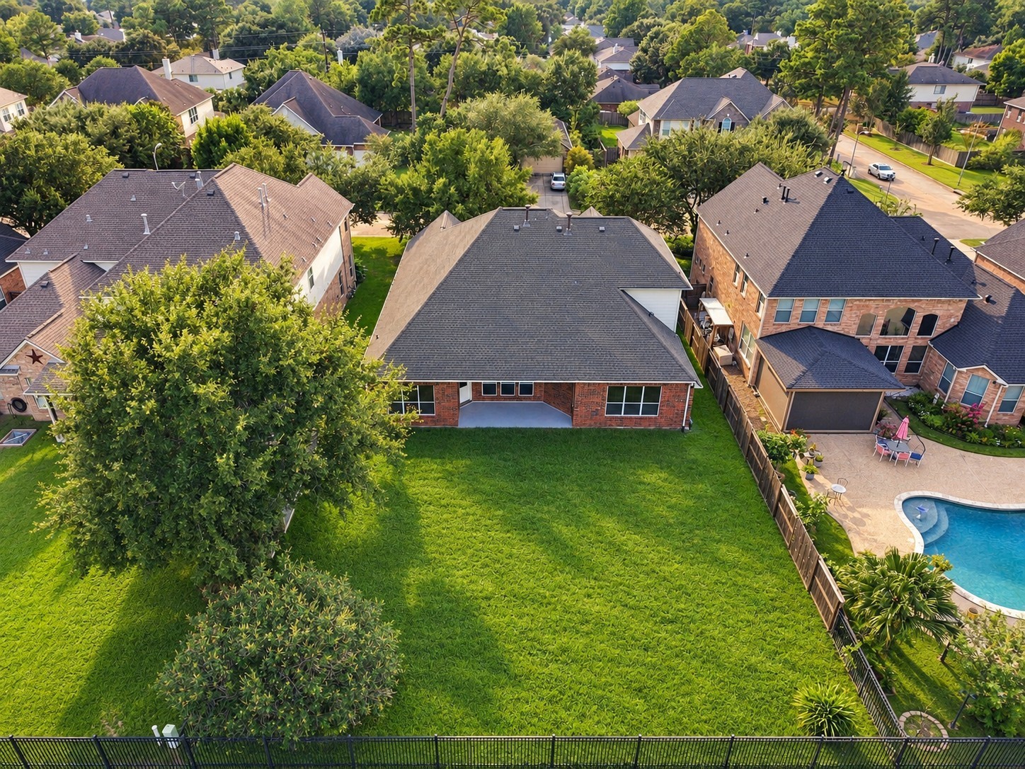 This drone perspective emphasizes the property's prime lot layout. The deep back lawn provides an incredible canvas for outdoor living.