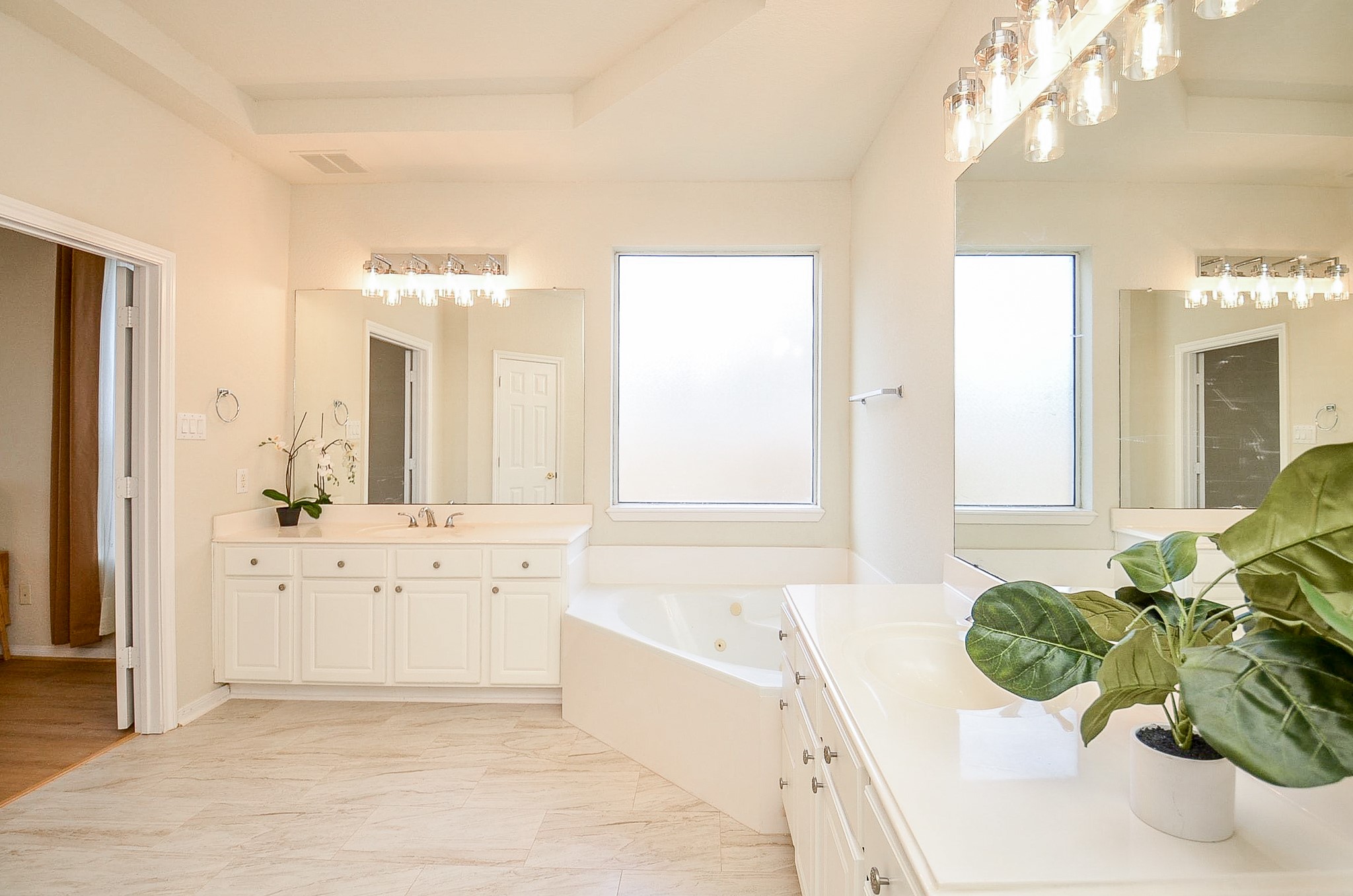 Start and end the day with room to yourself. The spacious primary bath features separate vanities, a soaking tub, natural light and a layout designed to give both sides their own space.