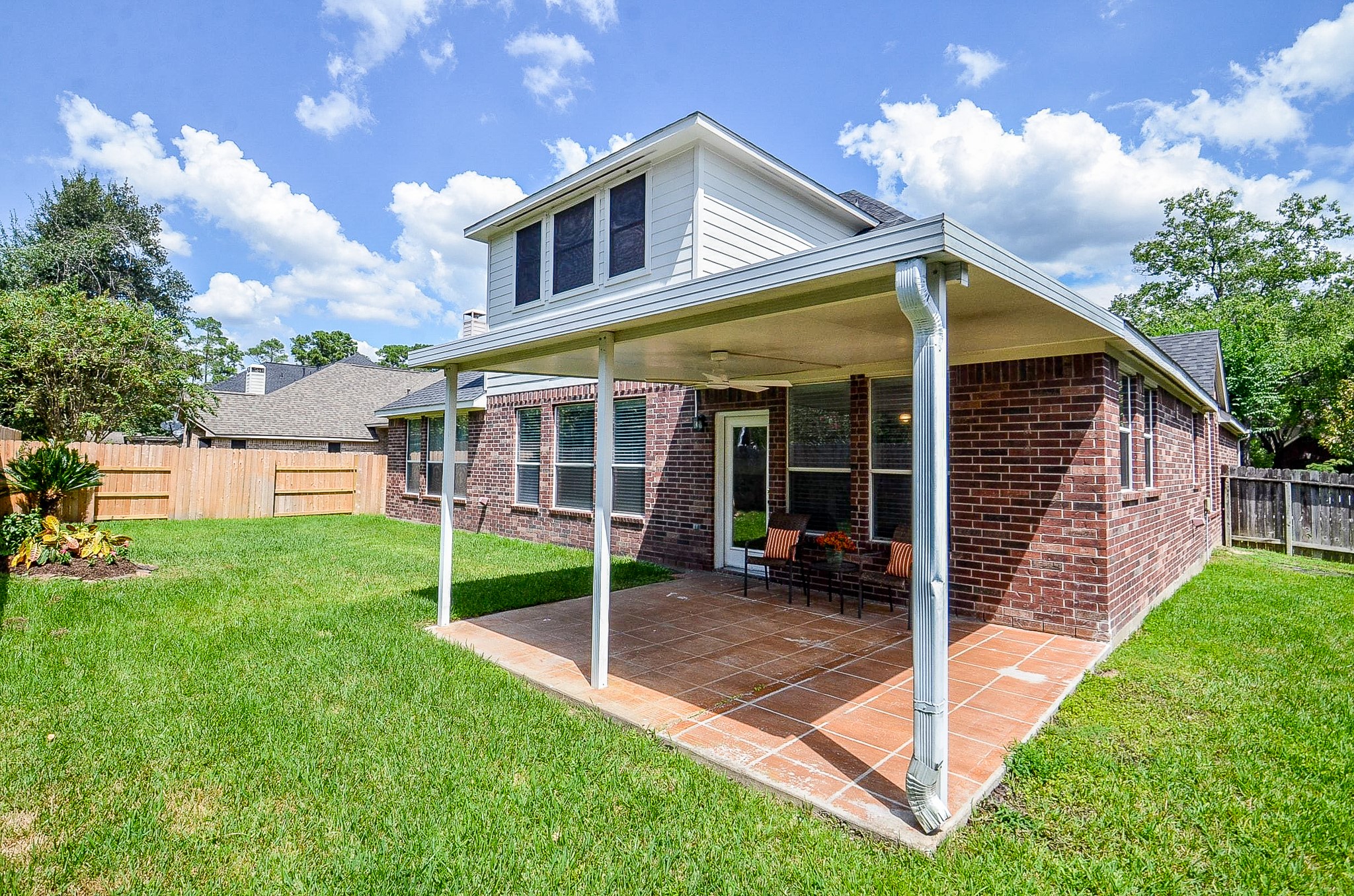 Weekend plans can happen right at home. Set up the grill, add a dining table and settle in under the covered patio while still having plenty of grassy yard beyond for kids, pets and outdoor fun.