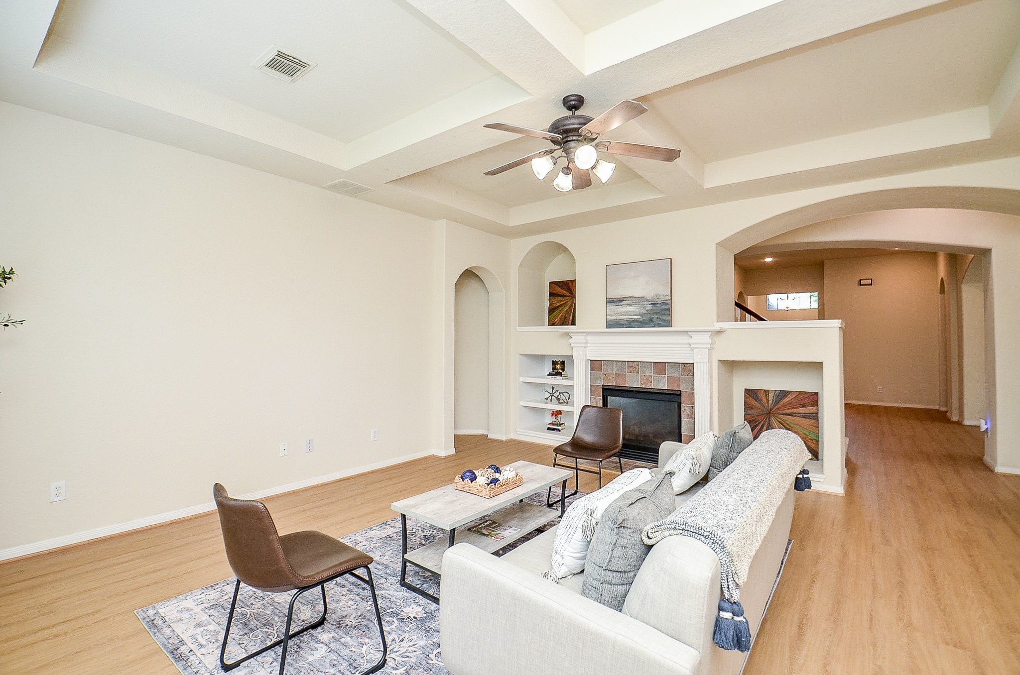 Theres room to spread out without losing that comfortable feel. A central fireplace anchors the family room, while built-in shelving gives you a natural place for books, photos and the things that make a house feel like yours.