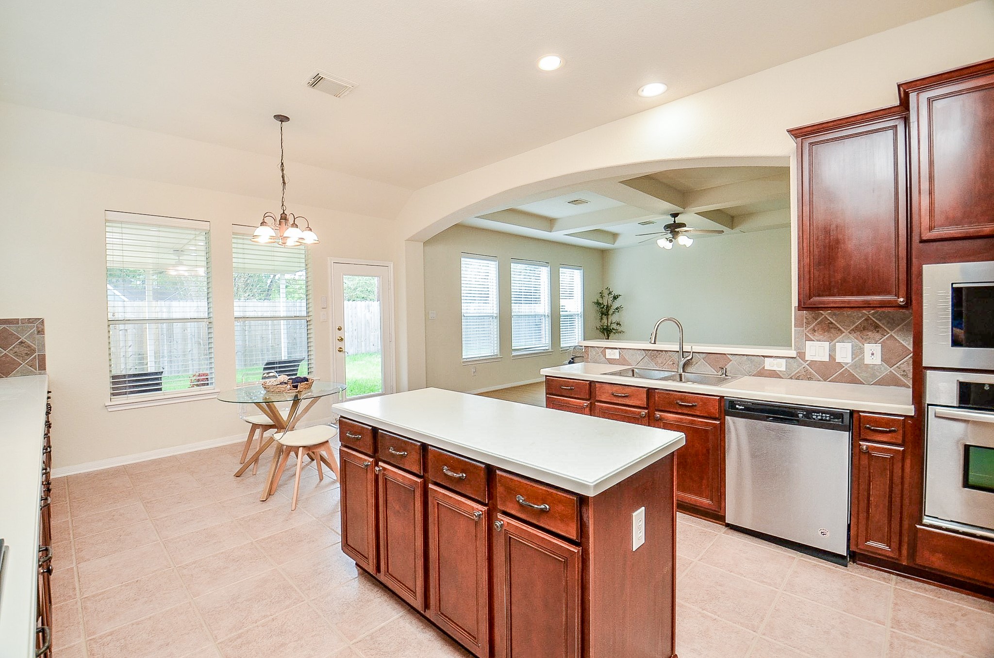 The open floor plan  keeps the kitchen connected to the family room, while the island provides additional workspace and storage.