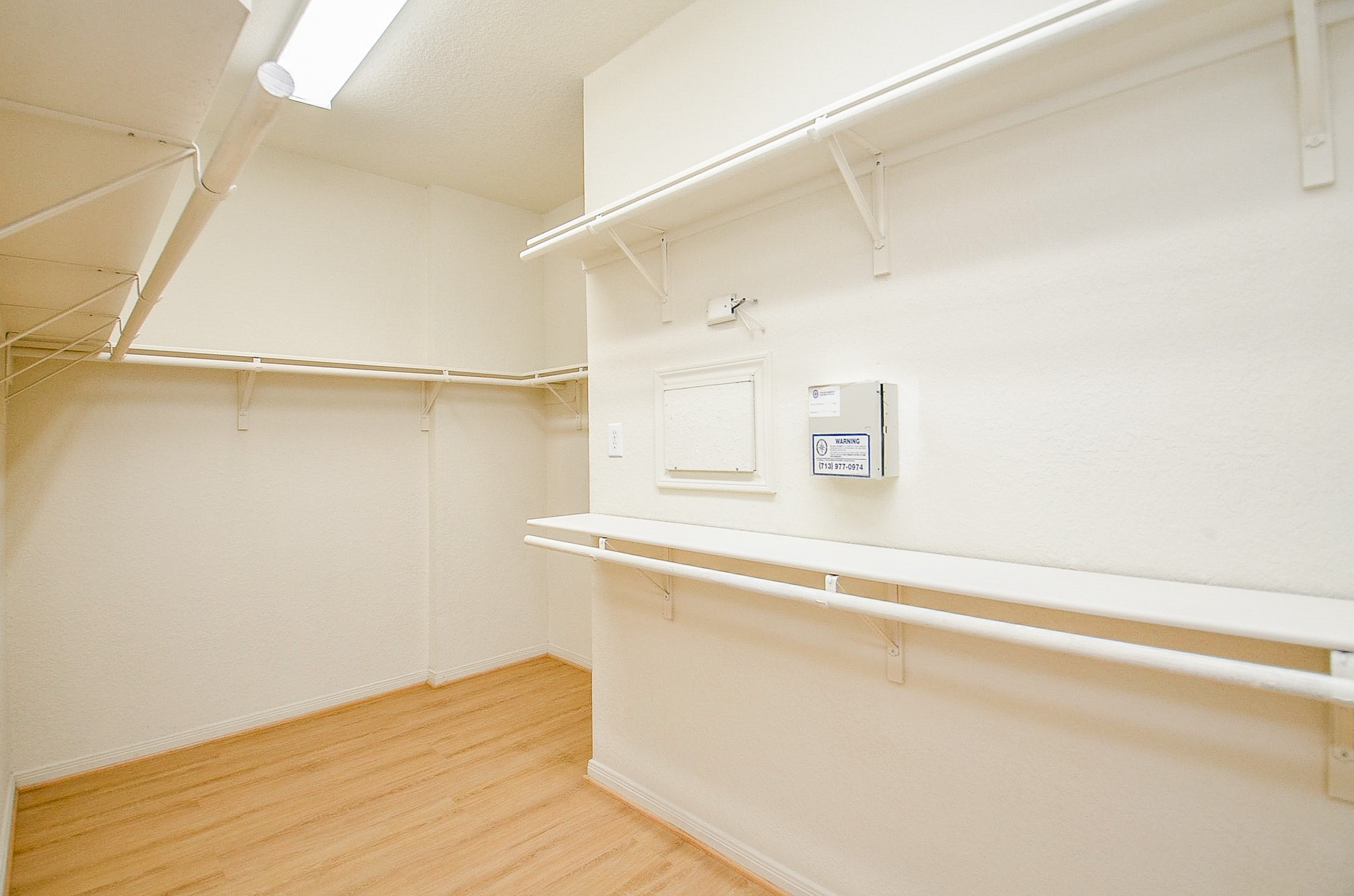 No need to compromise on closet space. This oversized walk-in offers hanging and storage space on multiple walls with plenty of room to keep everything organized.