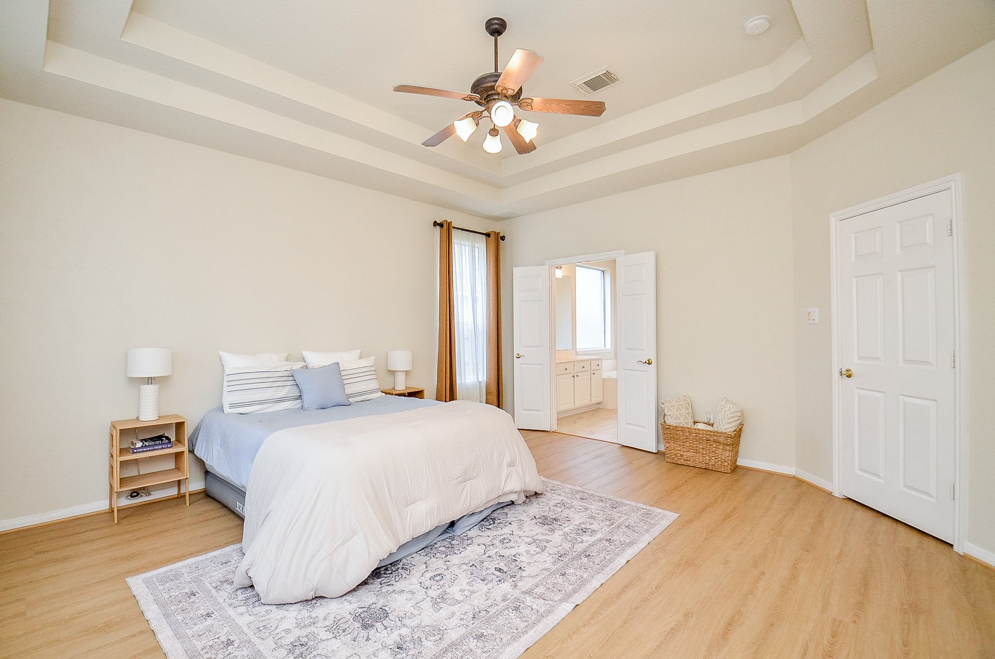Another view shows just how spacious this primary suite really is. The private bath is only steps away, creating a comfortable retreat tucked away on the first floor.