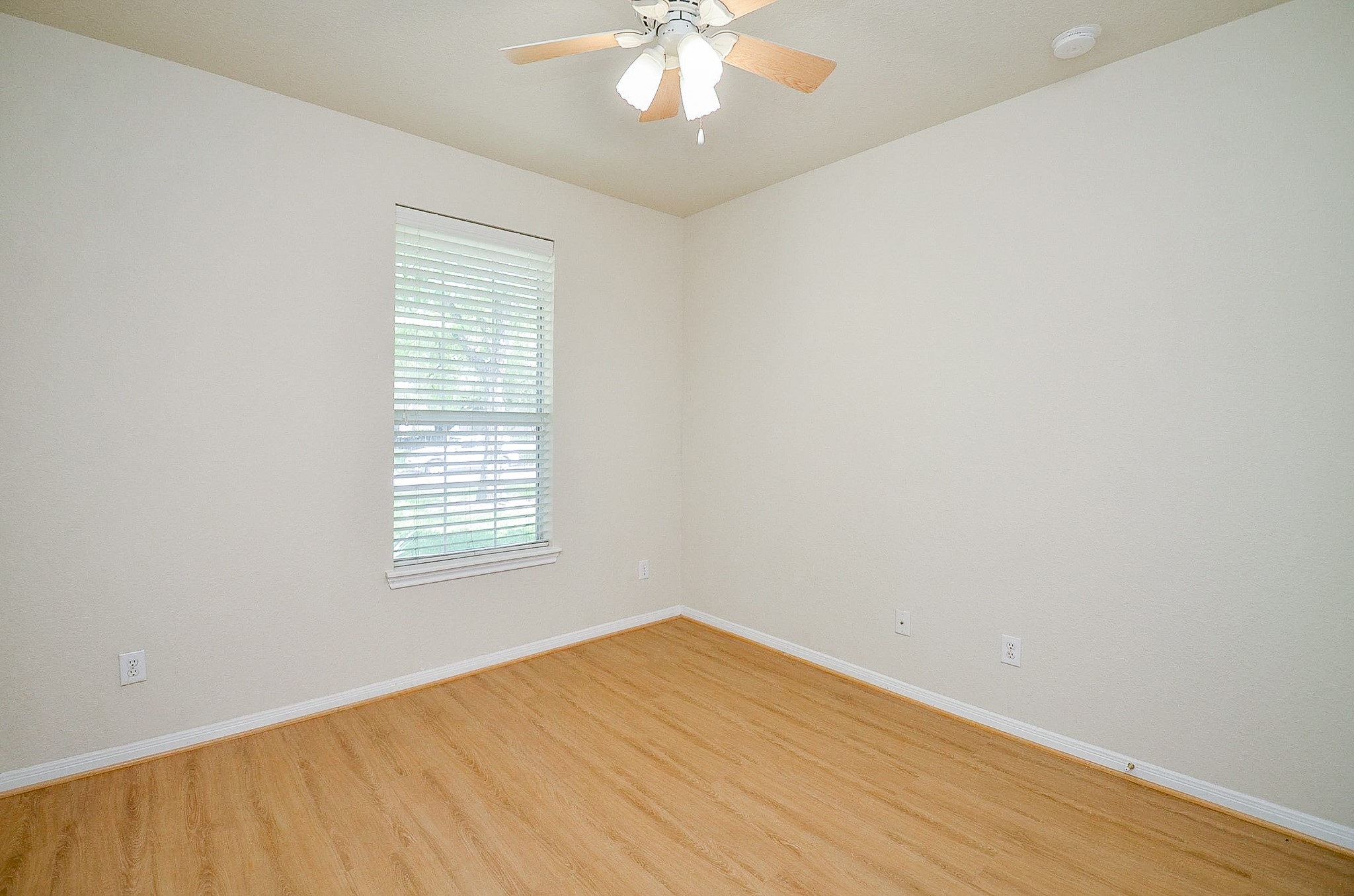 No upstairs trek at the end of the day. This secondary bedroom is one of three located on the main floor, keeping all four bedrooms conveniently together downstairs.