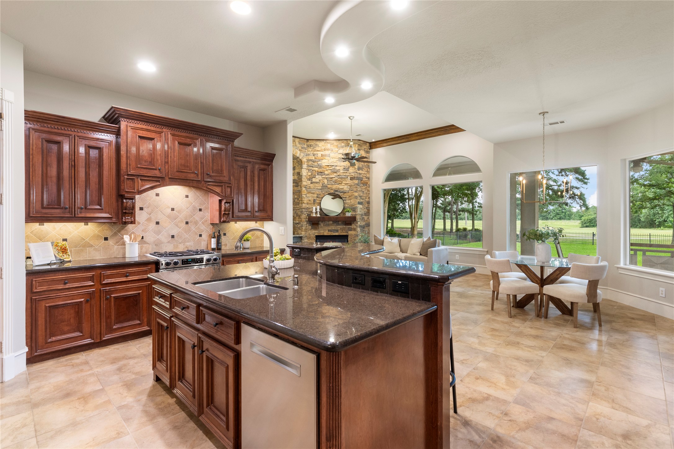 Extensive cabinetry, double ovens, and a gas cooktop create a well planned kitchen for buyers who enjoy cooking and hosting. The space opens easily to the surrounding gathering areas for a connected lifestyle.