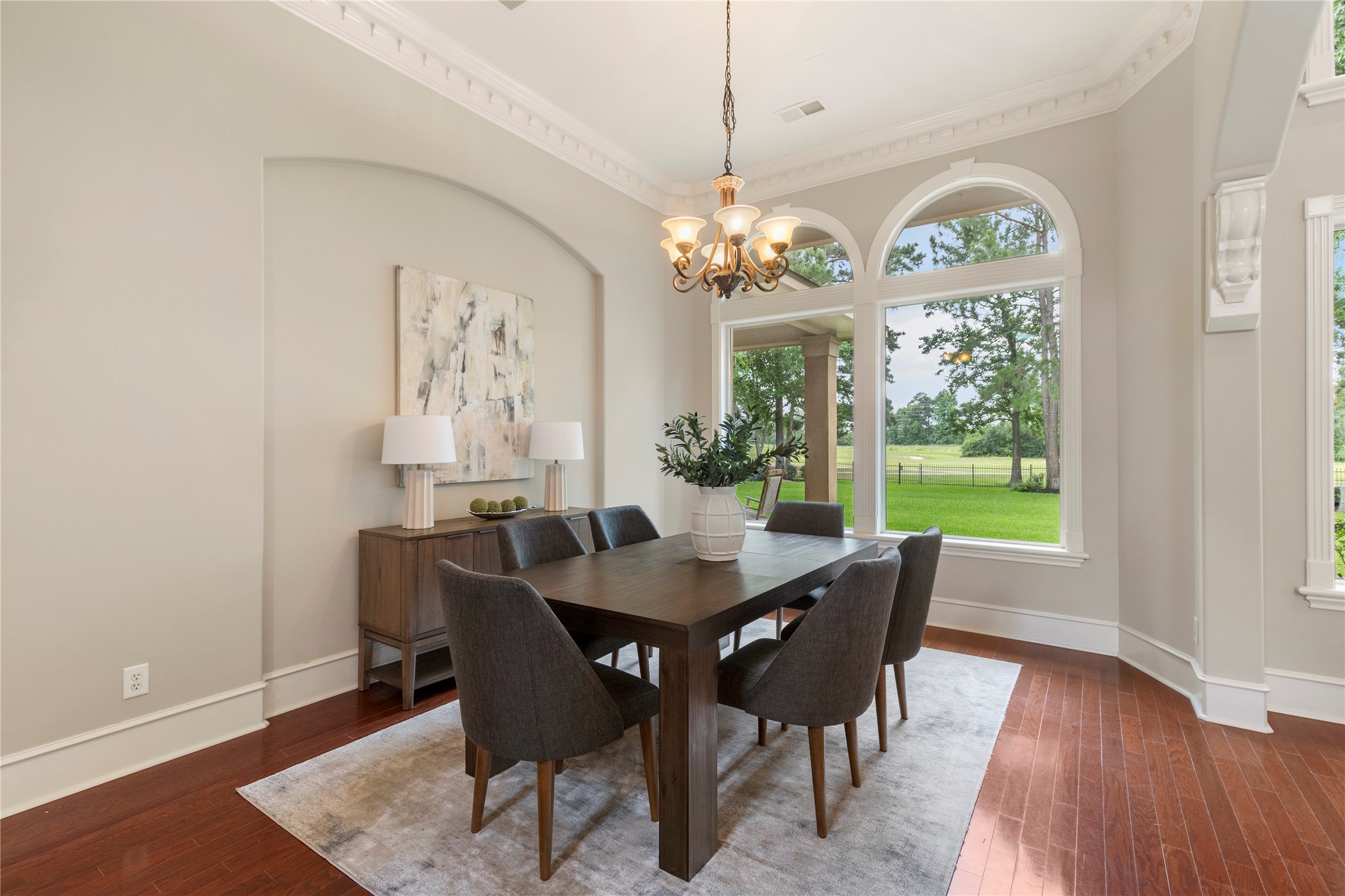 Another view of the dining room highlights the connection between the formal spaces and the outdoors. Large windows make the room feel bright and connected to the homes scenic setting. Another view of the dining room highlights the connection between the formal spaces and the outdoors. Large windows make the room feel bright and connected to the homes scenic setting.