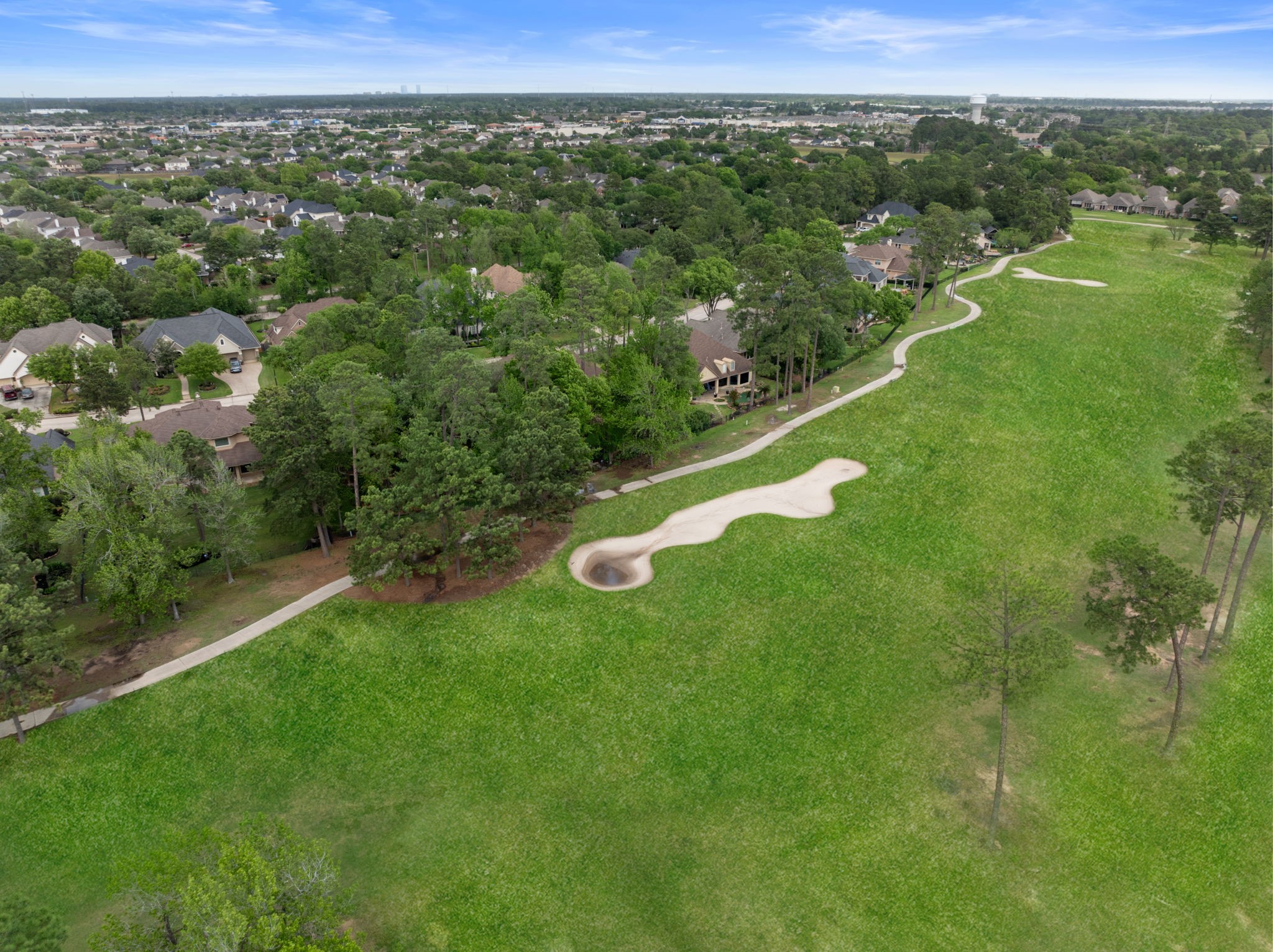 Expansive golf course views open behind the property, offering a rare backdrop with no visible homes across the fairway. The setting creates a peaceful, resort like feel while still keeping daily conveniences close.