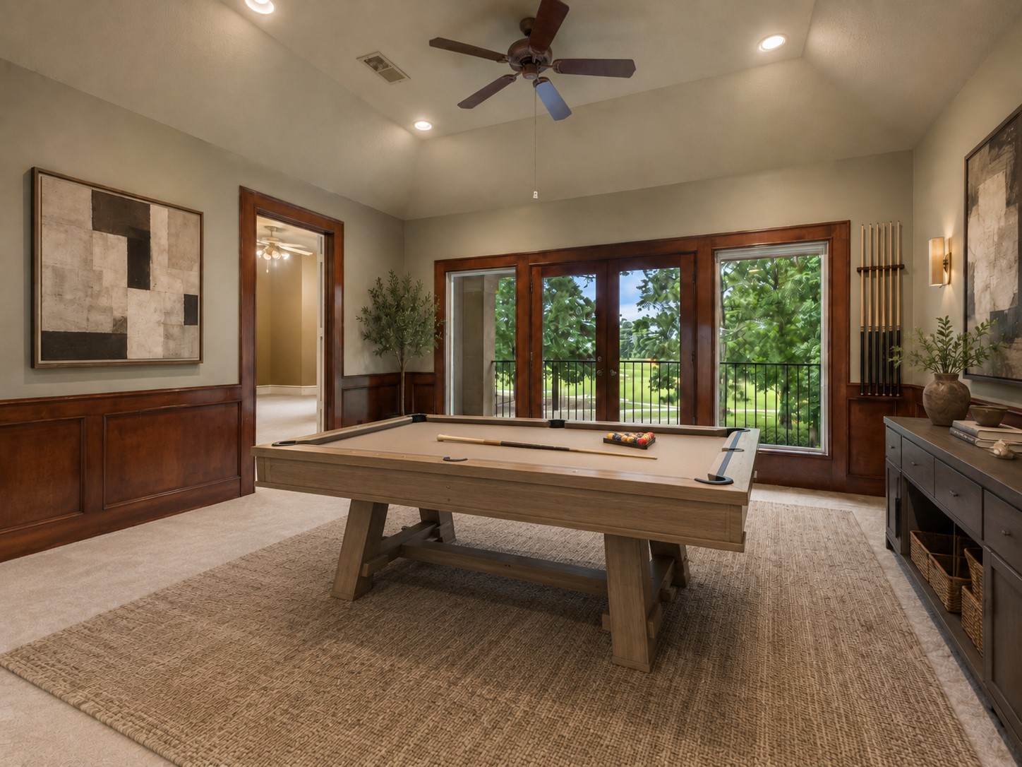 Upstairs, the game room opens to a balcony and offers a flexible setting for recreation, homework, or casual gathering. The rooms size and placement create a separate destination away from the main living areas. (Digitally Staged)