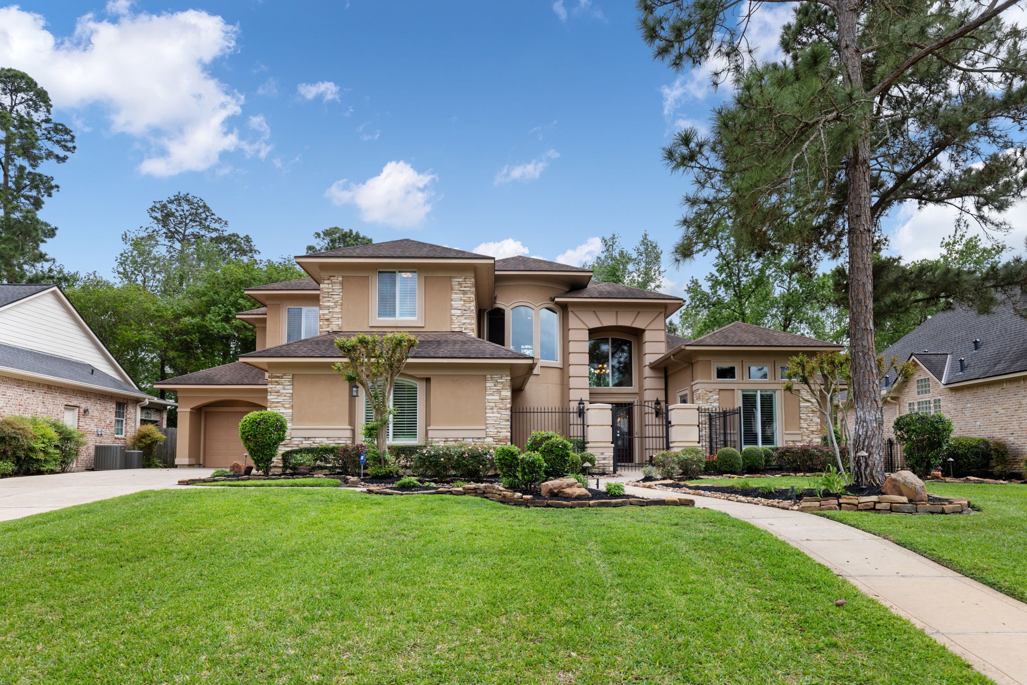 A stately two story exterior sets the tone for this custom Windrose residence, positioned on an oversized golf course lot with mature trees and an impressive street presence. The home offers a refined sense of arrival in The Fairways section, a quiet double cul-de-sac enclave.