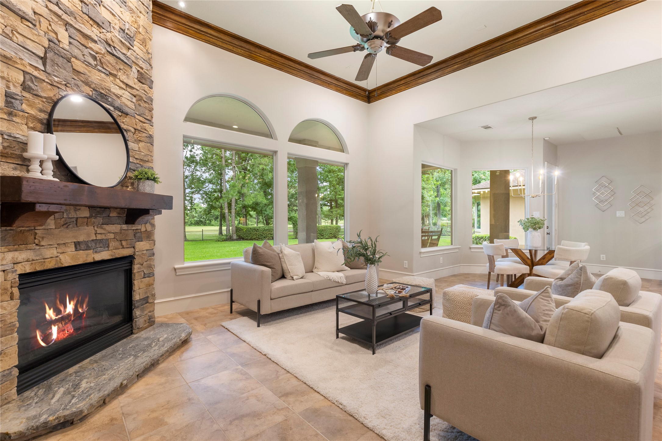 A closer view of the fireplace wall highlights the custom stonework and mantle detail from the den remodel. This space feels grounded, substantial, and thoughtfully finished.