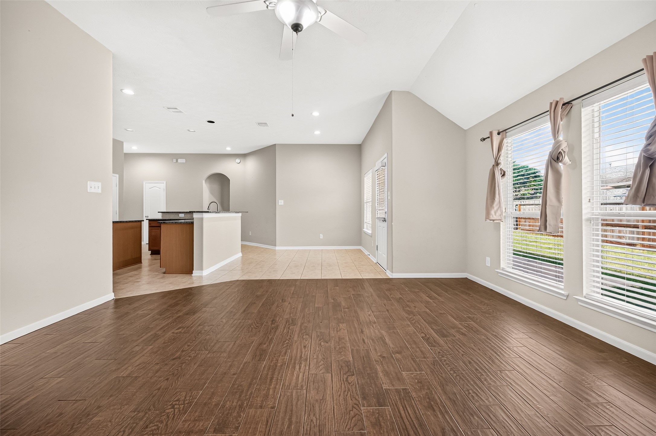 Another view of the living area highlighting its generous floor space and open connection to the kitchen.