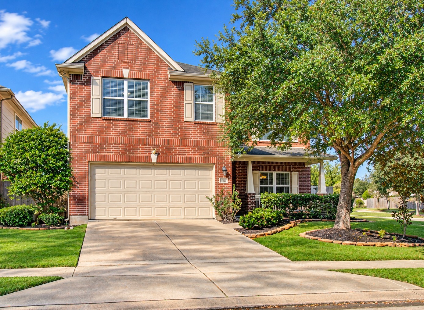 Welcome home! This attractive two-story brick residence features classic architectural details, a welcoming covered front porch, and a spacious driveway leading to a two-car garage. Beautiful mature trees, established landscaping, and a well-maintained lawn create an inviting first impression. The charming exterior and appealing streetscape set the stage for a home with room to relax, entertain, and make lasting memories. Discover the possibilities and envision making this inviting property your own!