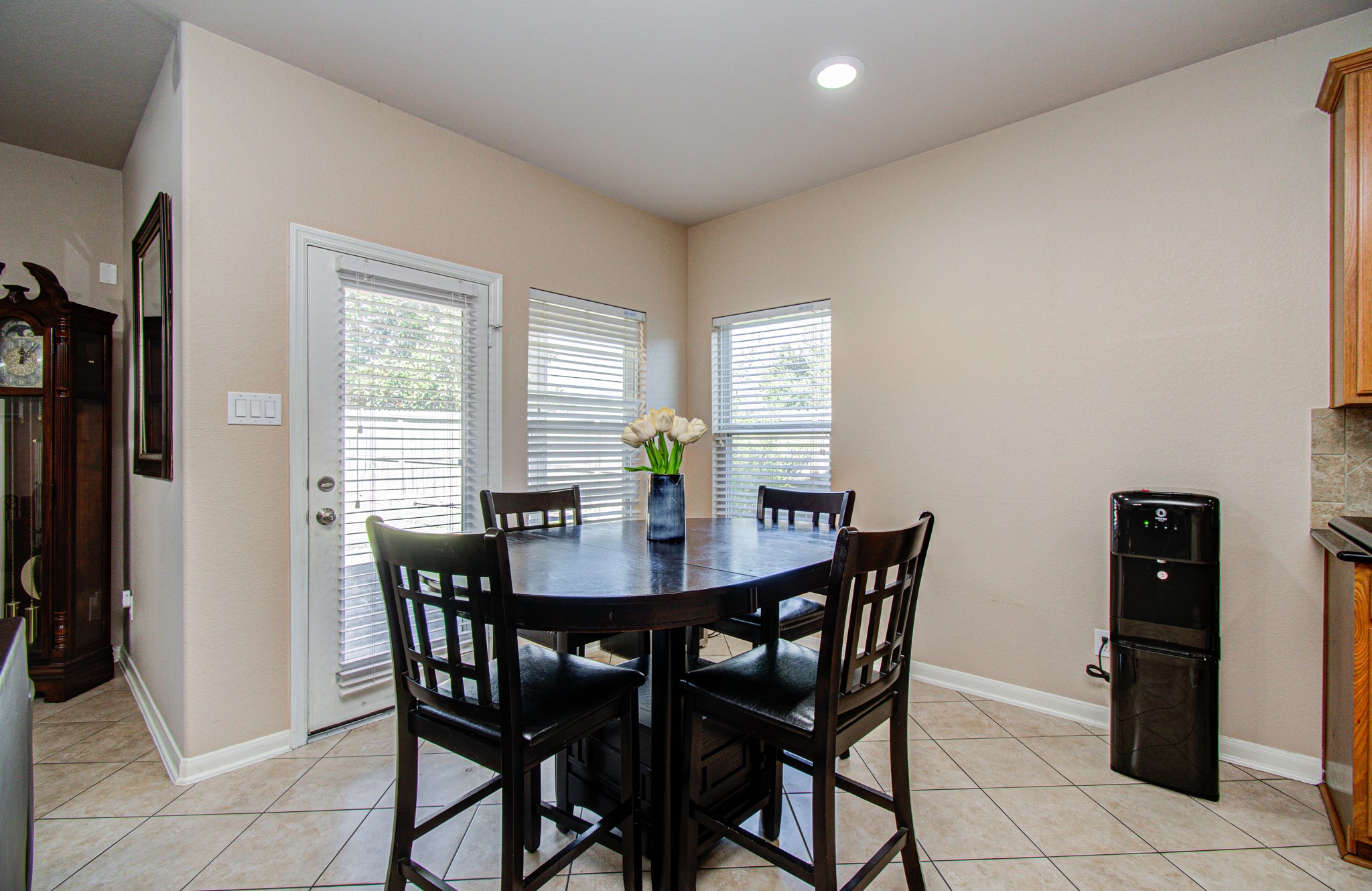 Enjoy the convenience of a dedicated dining area just off the kitchen, creating a comfortable setting for everyday meals, casual breakfasts, and easy family gatherings. Its close proximity to the kitchen makes serving meals and entertaining guests effortless, whether you're enjoying a quiet dinner at home or hosting a weekend get-together.