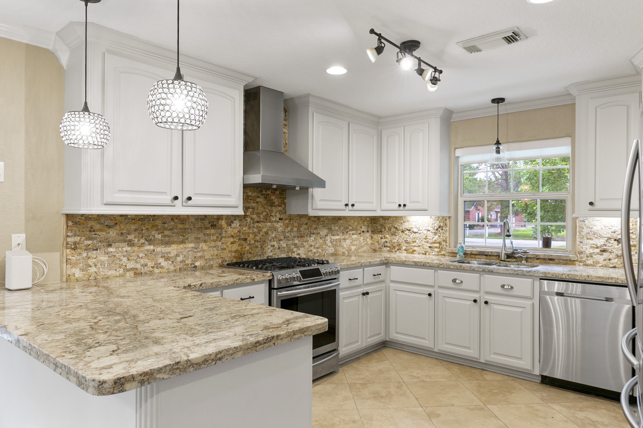 Granite countertops and stainless steel finishings throughout