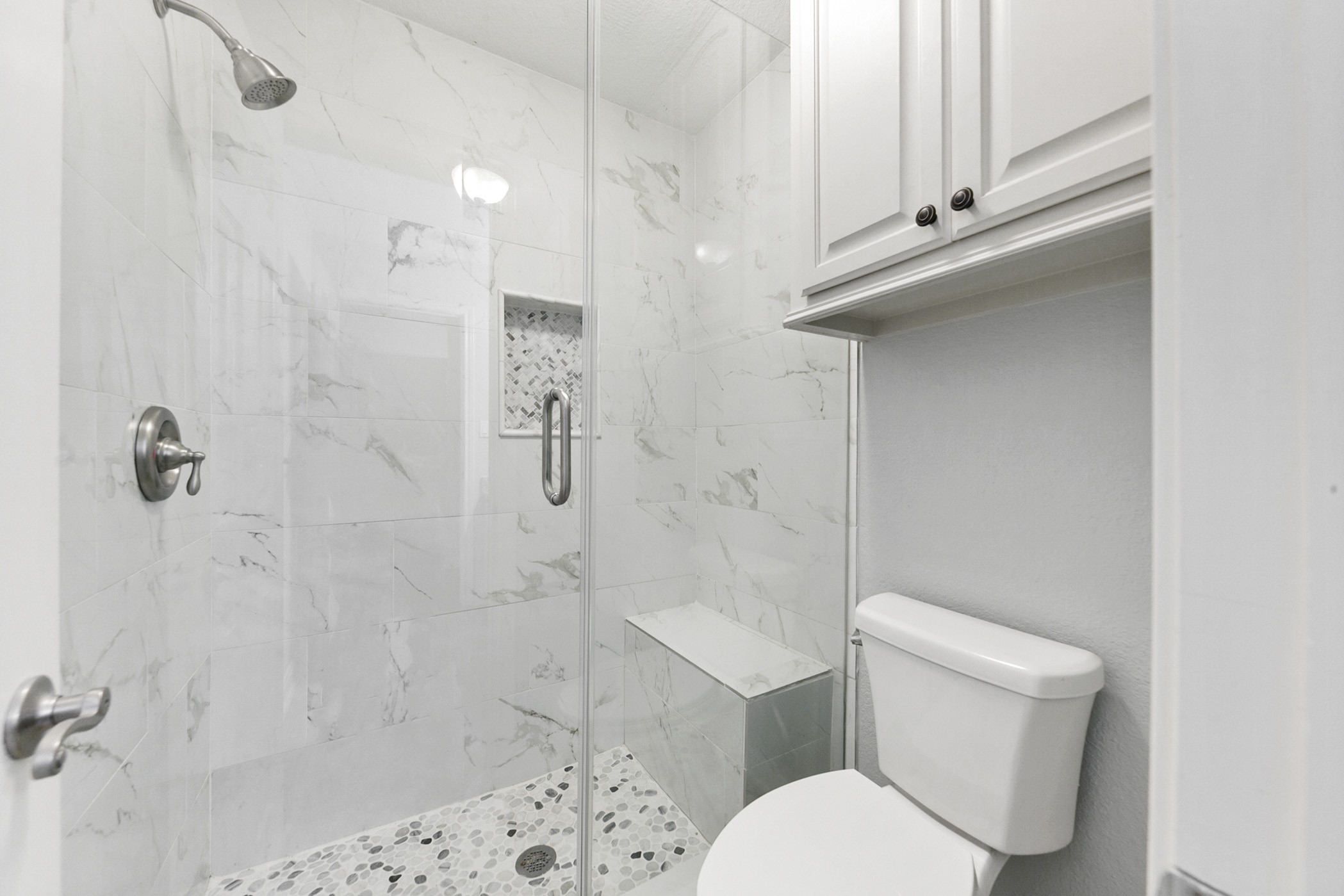 Private shower area in secondary bathroom