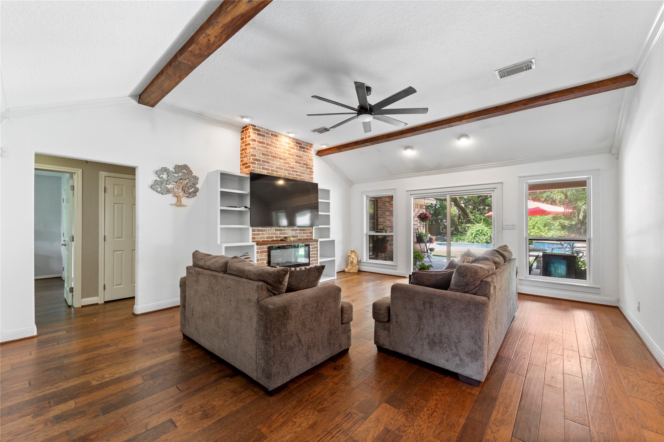 Sliding doors leading to back yard and pool