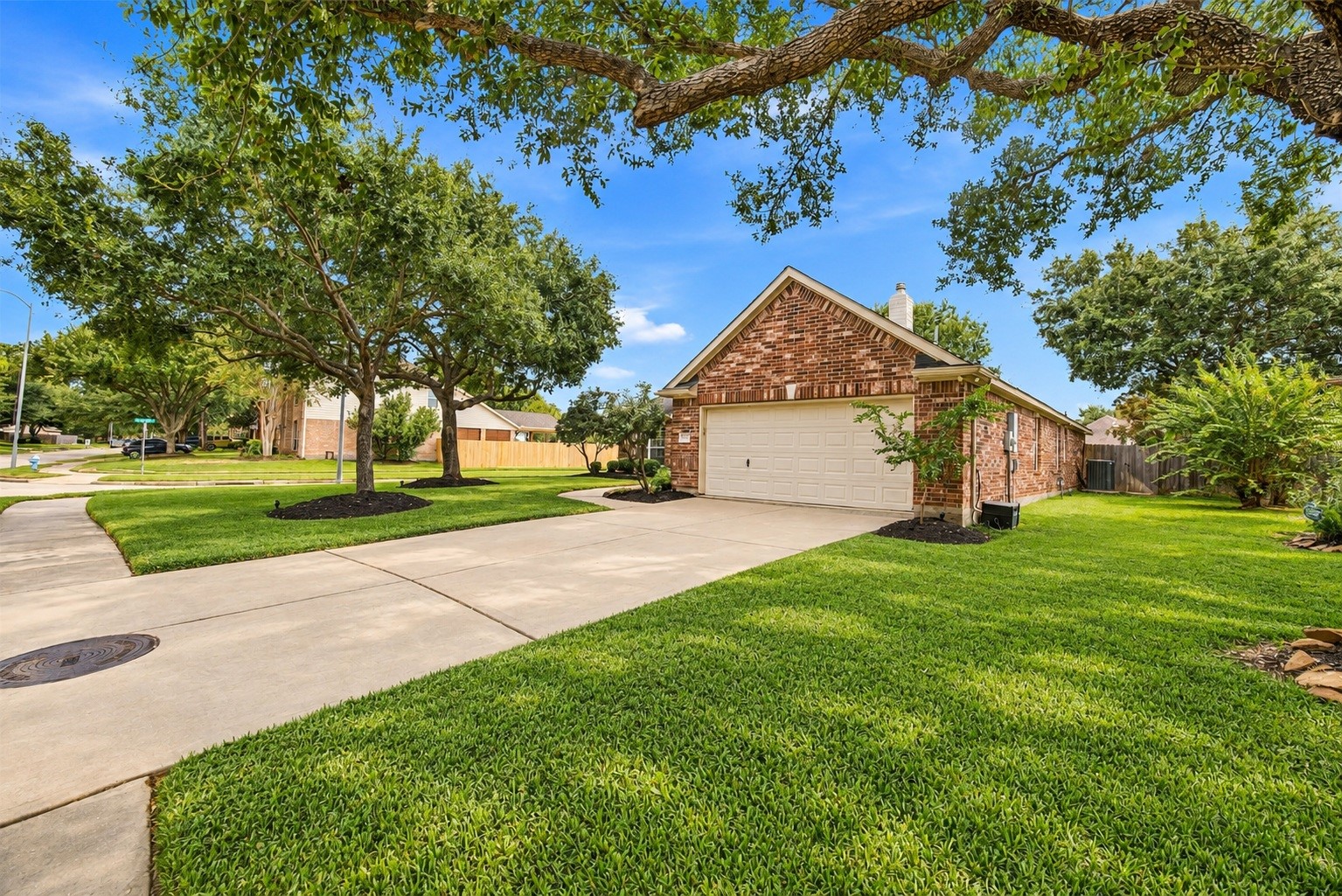 The home's double-wide driveway and attached two-car garage provide plenty of convenient parking. The home's double-wide driveway and attached two-car garage provide plenty of convenient parking.