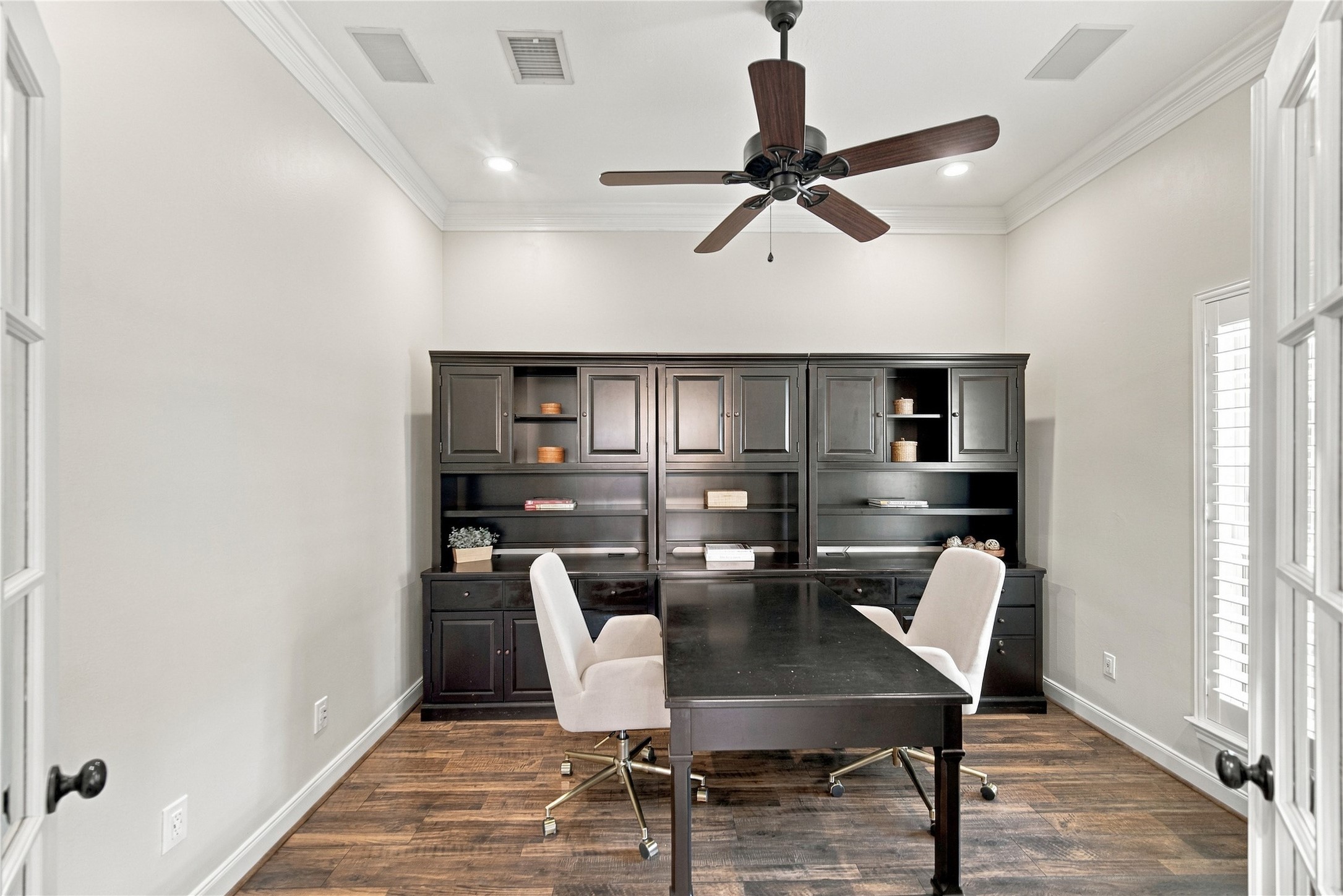 Conveniently located near the front door, the home office is ideal for working from home. The office furniture and chairs shown here may remain with the home at no additional charge if desired. Conveniently located near the front door, the home office is ideal for working from home. The office furniture and chairs shown here may remain with the home at no additional charge if desired.