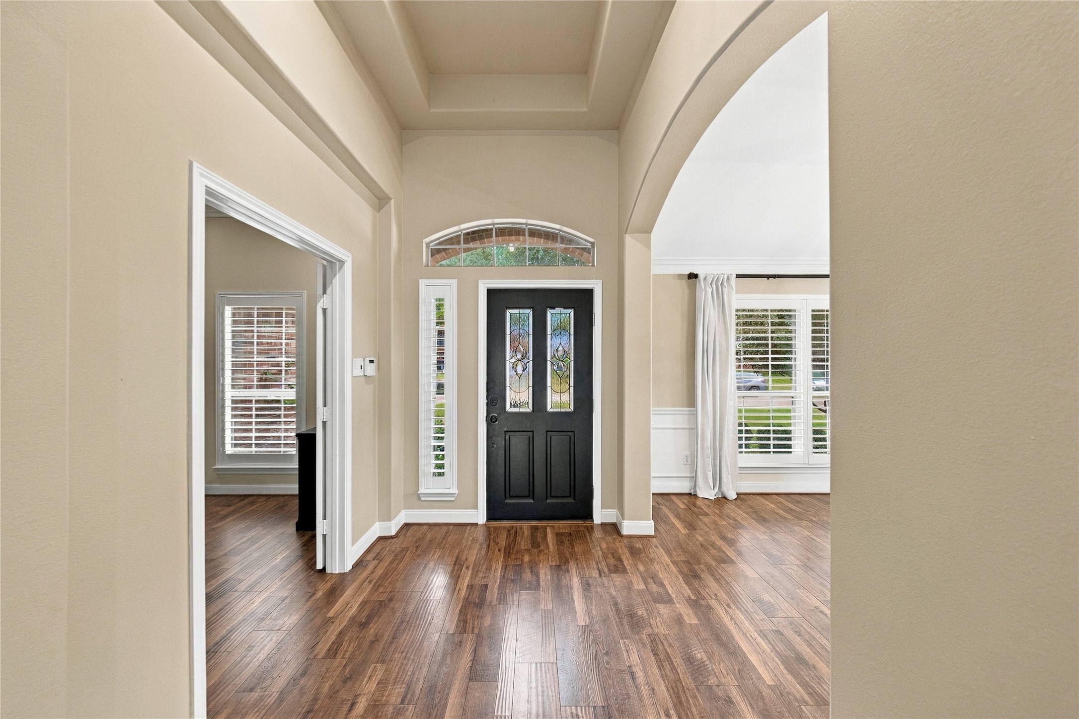 Looking back toward the front door, you'll appreciate the home's lovely entryway, flanked by the home office on the left and formal dining room on the right. Looking back toward the front door, you'll appreciate the home's lovely entryway, flanked by the home office on the left and formal dining room on the right.
