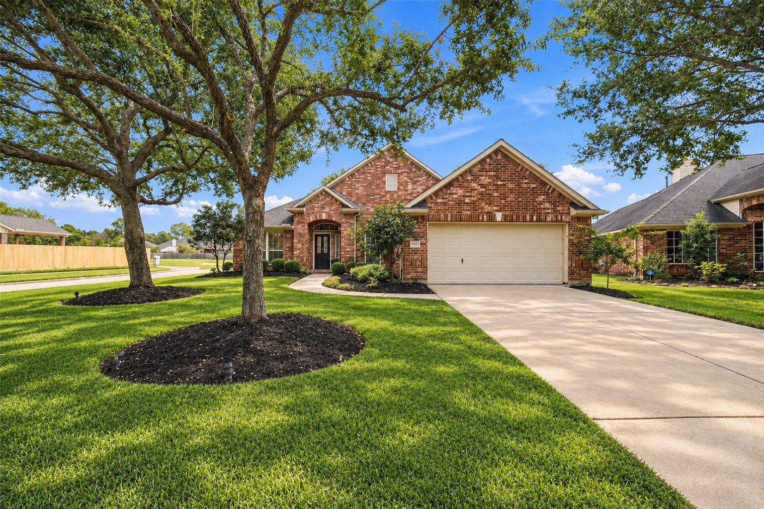 Welcome home to 23706 Indian Hills Way! Situated on a gorgeous corner lot, this charming home is shaded by mature trees and surrounded by attractive landscaping, creating wonderful curb appeal.