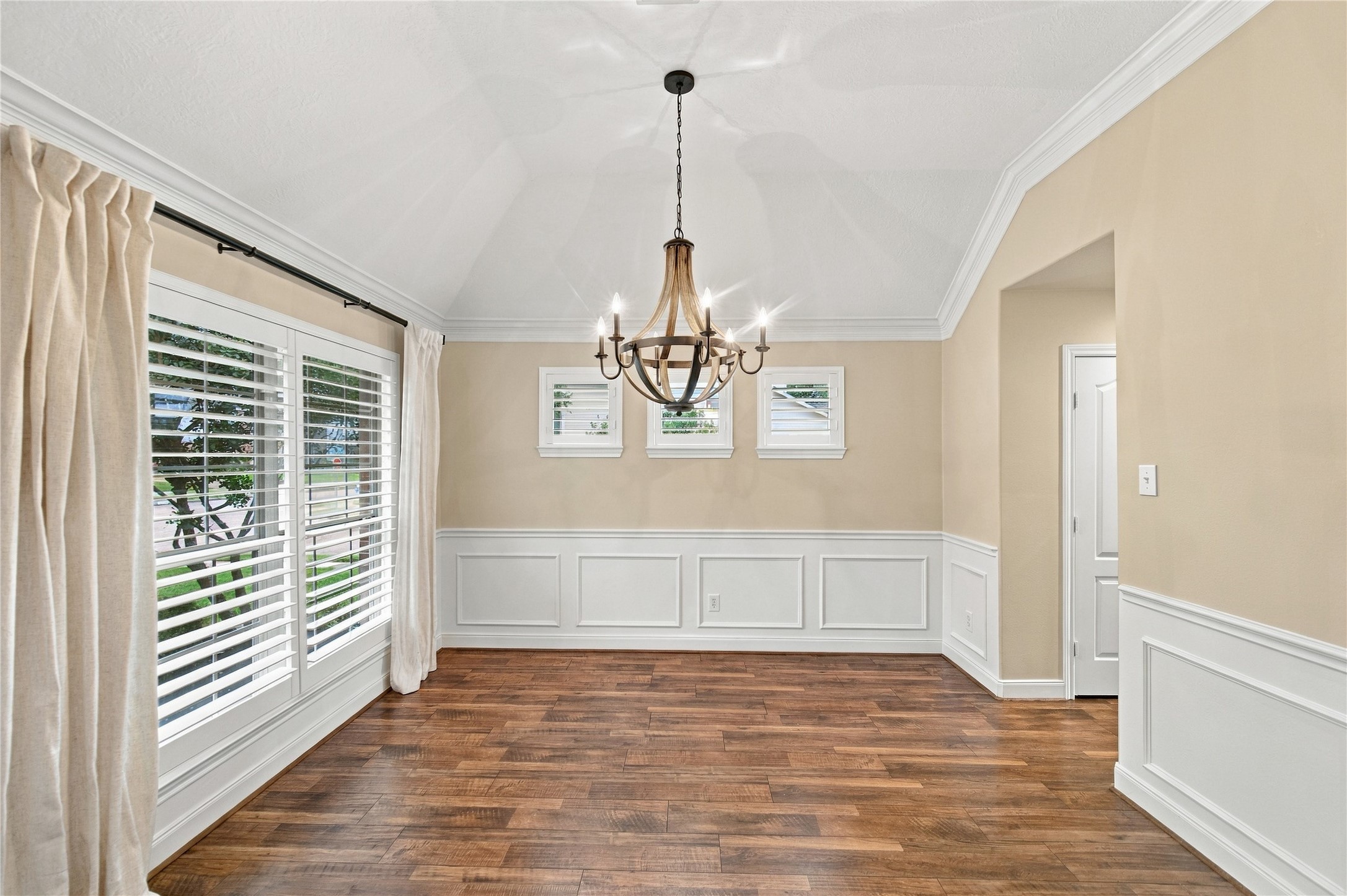 What an elegant dining room, complete with plantation shutters on its well-placed windows. You will appreciate the natural light that is abundant throughout the home, thanks to its many windows. What an elegant dining room, complete with plantation shutters on its well-placed windows. You will appreciate the natural light that is abundant throughout the home, thanks to its many windows.