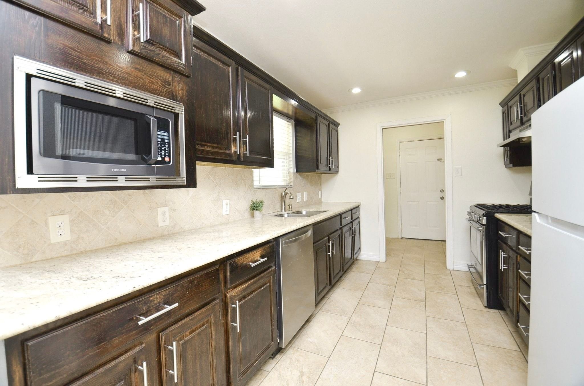 Cook up your favorite meals in this spacious kitchen.