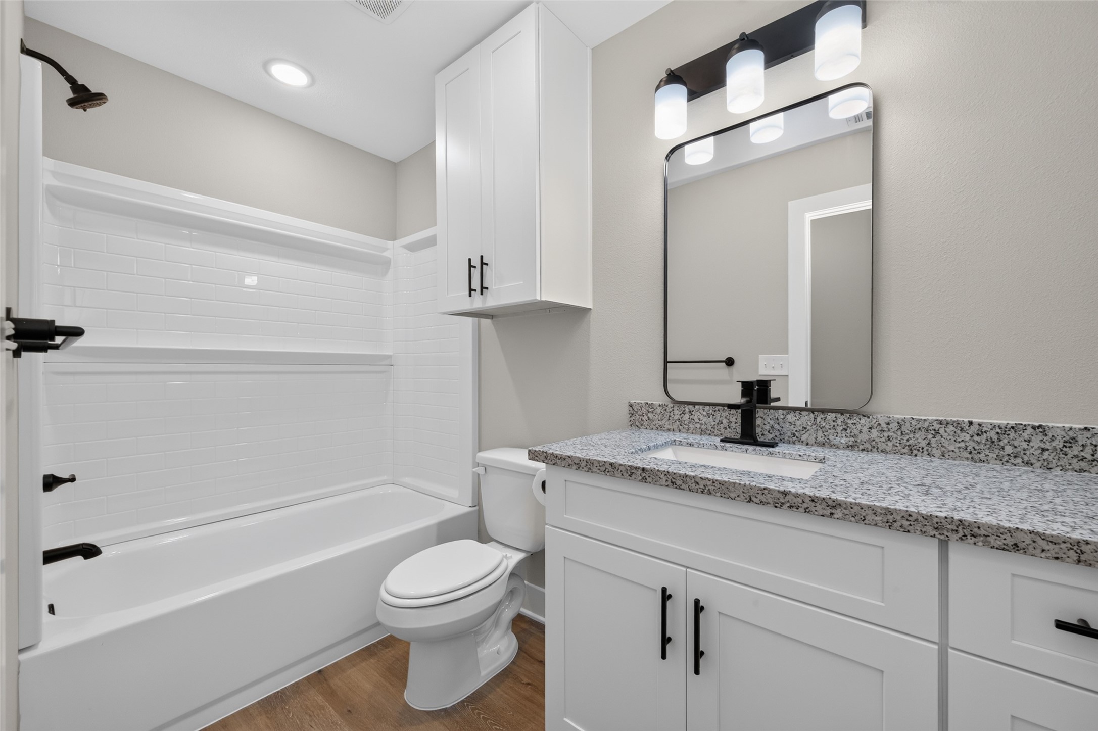 Second bathroom with shower/tub combo.