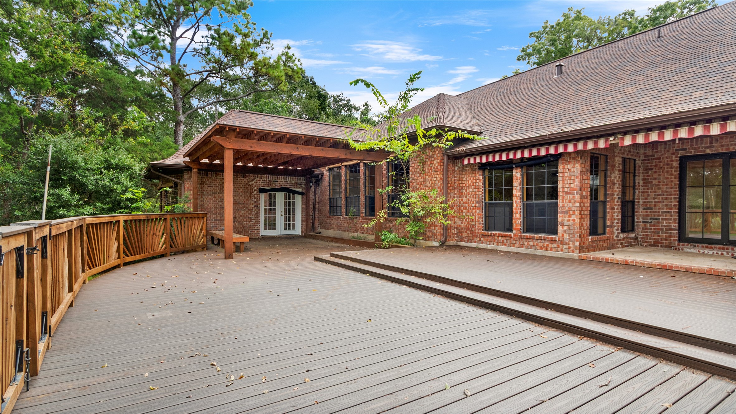 Covered patio and outdoor deck - this backyard is perfect for entertaining!