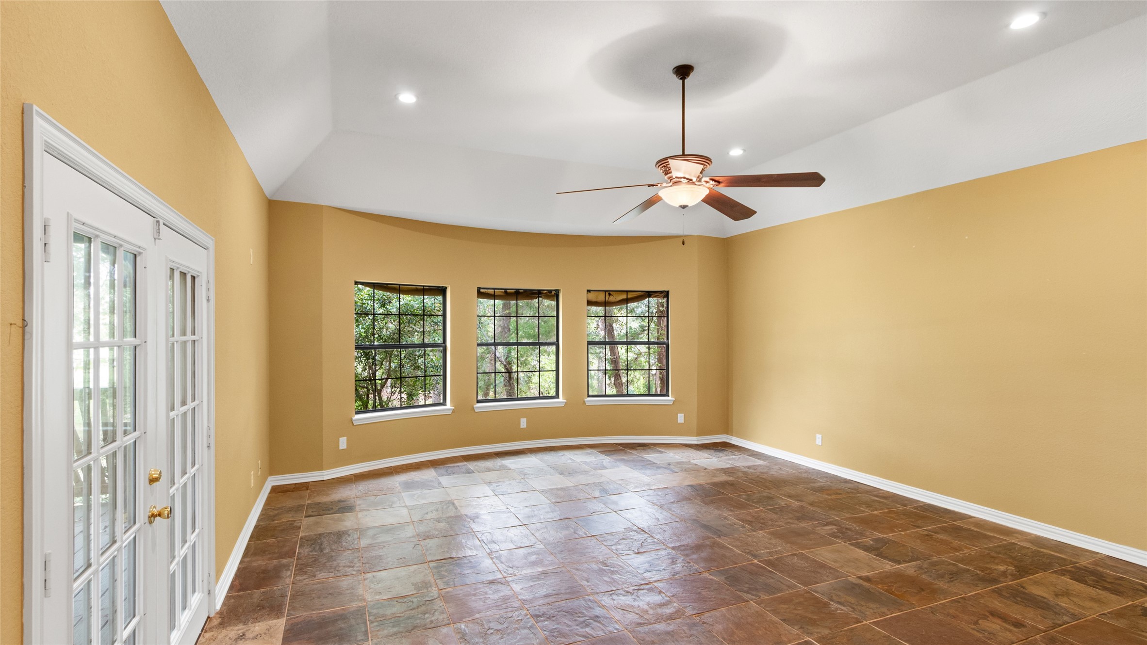 Huge primary bedroom with breathtaking waterfront views and private access to the deck.