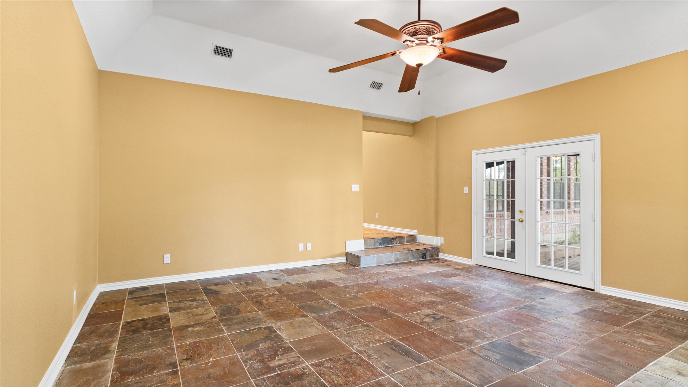 Huge primary bedroom with breathtaking waterfront views and private access to the deck.