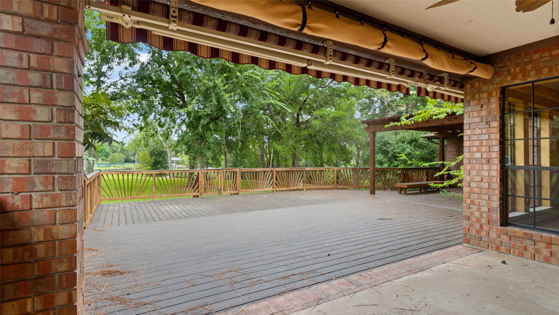 Covered patio and outdoor deck - this backyard is perfect for entertaining!