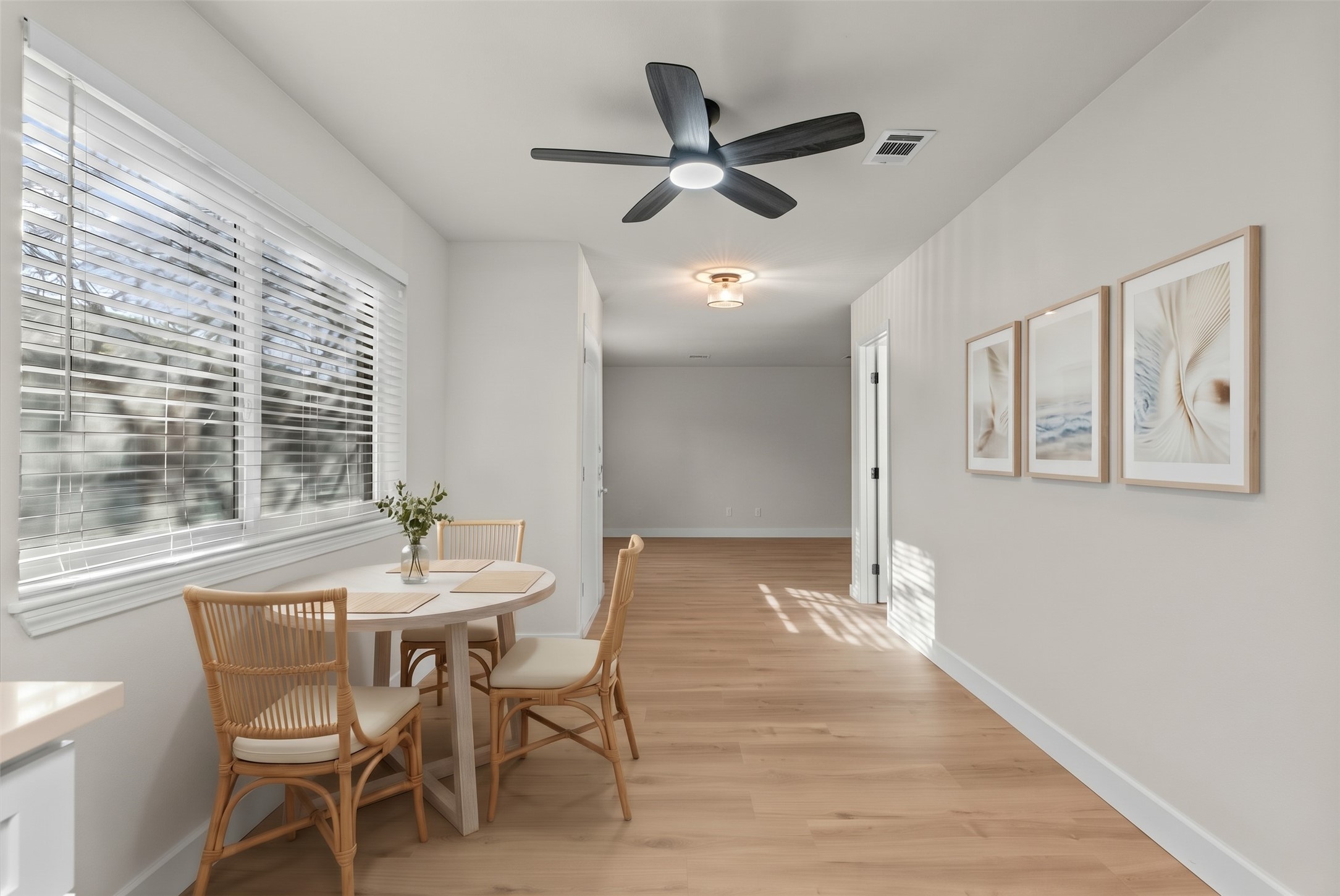 Continuous vinyl plank flooring creates a seamless, cohesive flow across the main living areas.