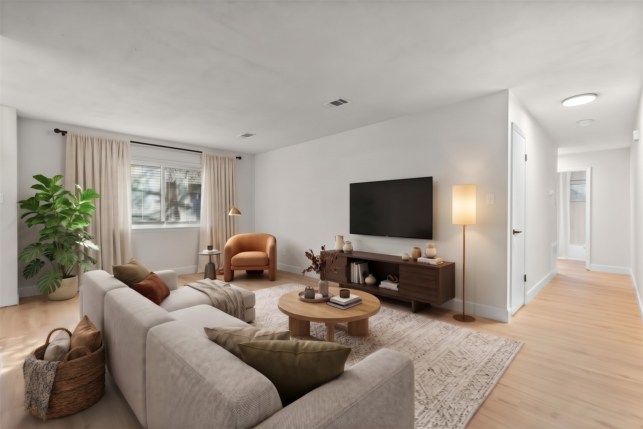 Expansive 19' x 11' living area highlighted by fresh paint, new baseboards, and luxury vinyl plank flooring throughout.