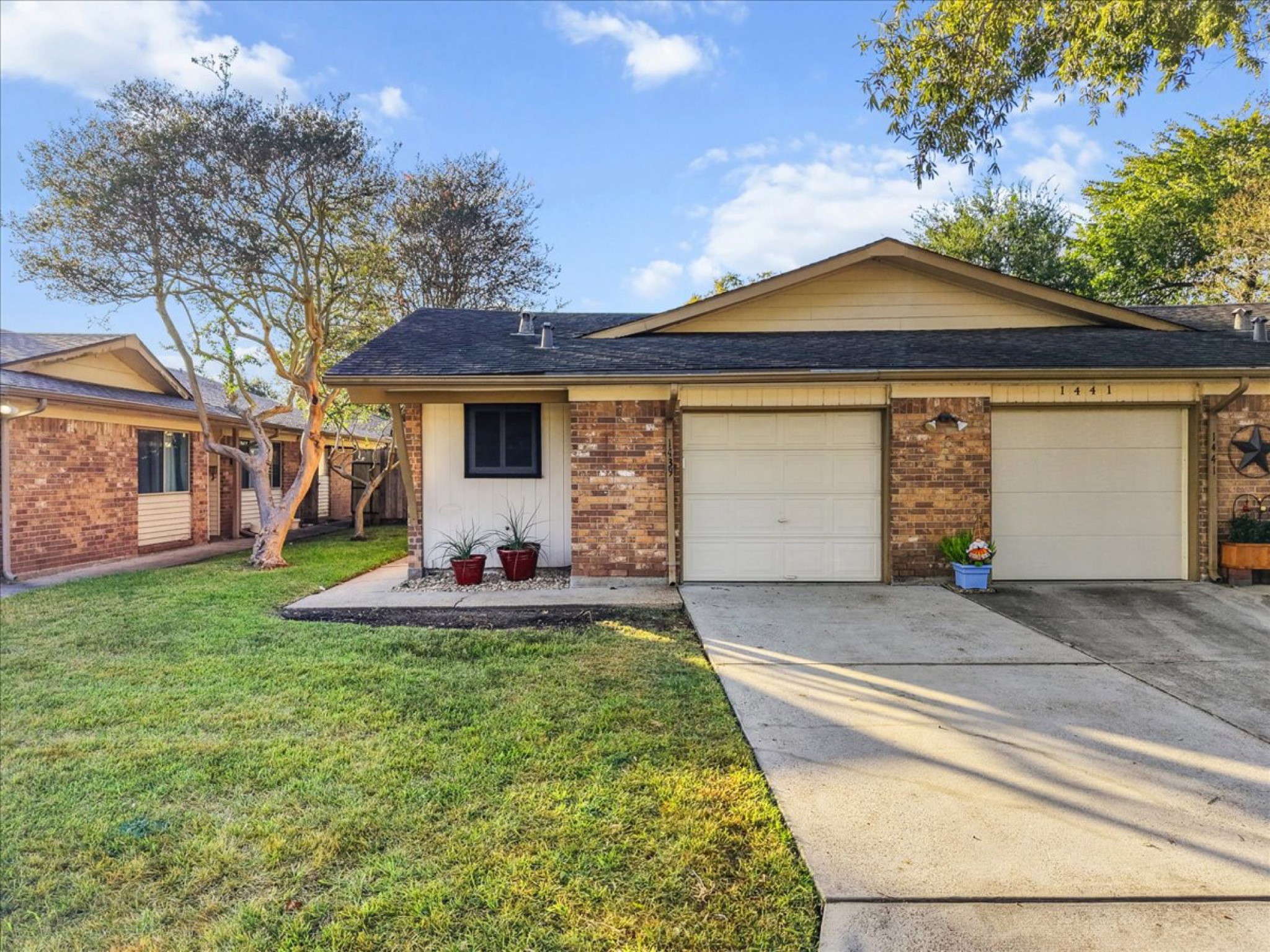Features manicured curb appeal, an attached one-car garage, and double-pane energy-efficient windows.