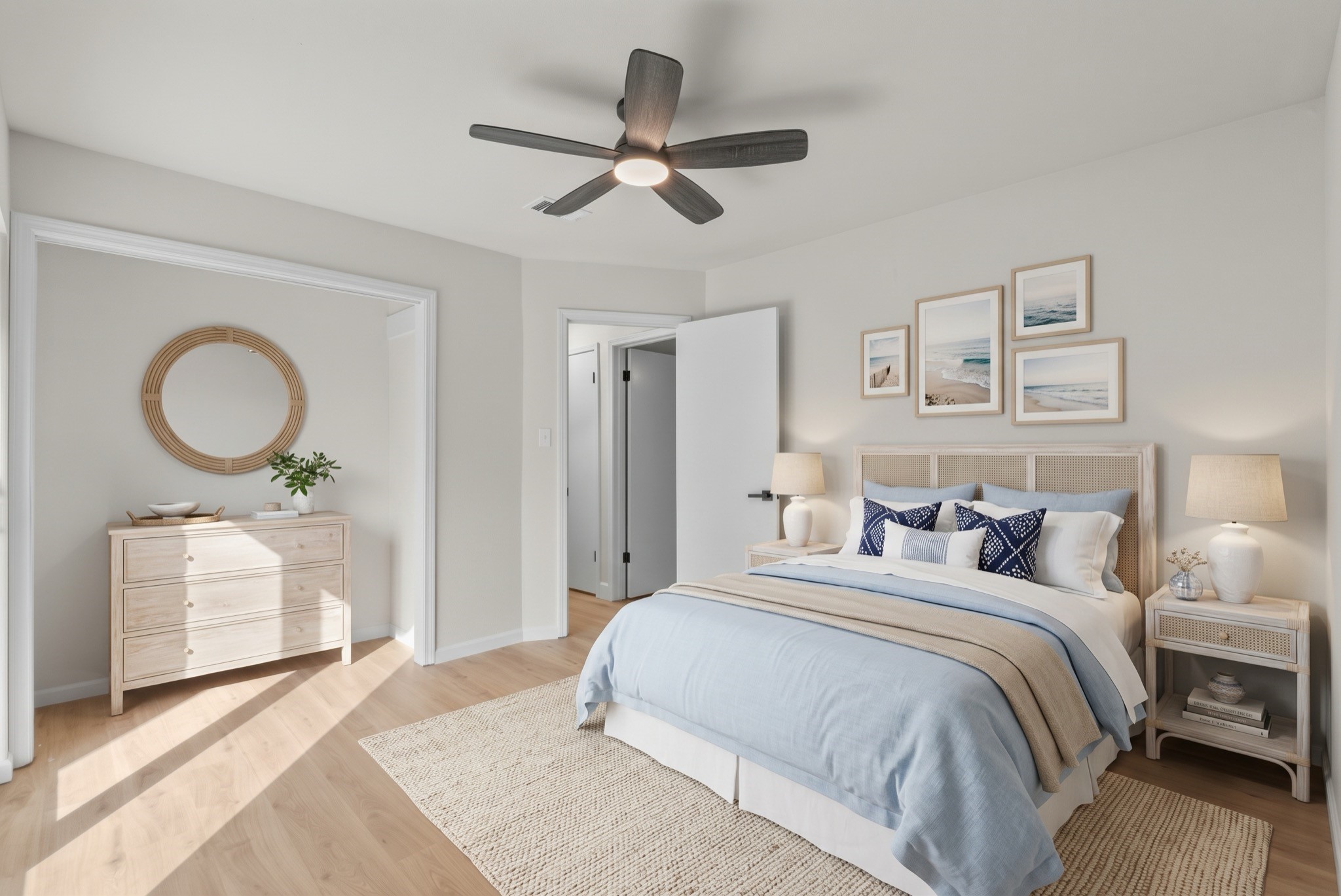 Spacious primary bedroom (11'5 x 13'1) featuring fresh neutral paint, updated baseboards, and a modern ceiling fan.