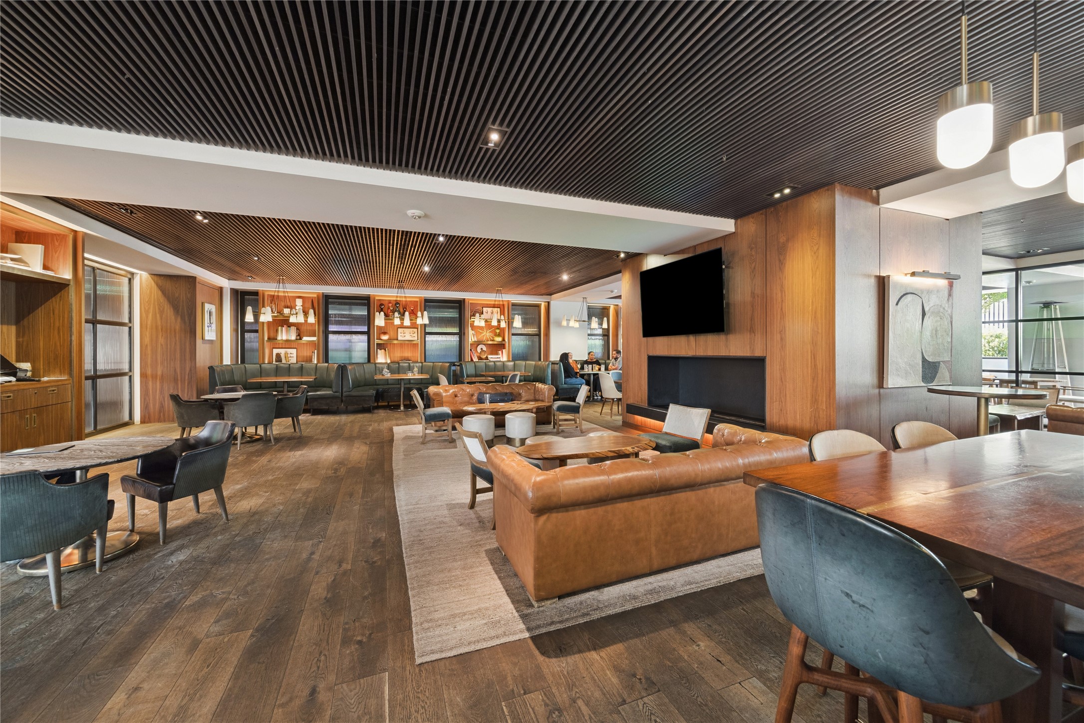 Adjacent lounge extends the hotel's gathering spaces beyond the main bar. More intimate areas support conversation away from the primary circulation routes.