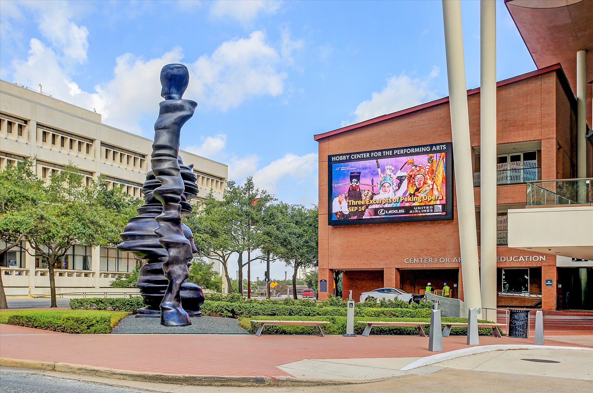 Hobby Center adds a performing arts destination within downtown's Theater District. Exterior view shows its connection to public art and the surrounding streets.